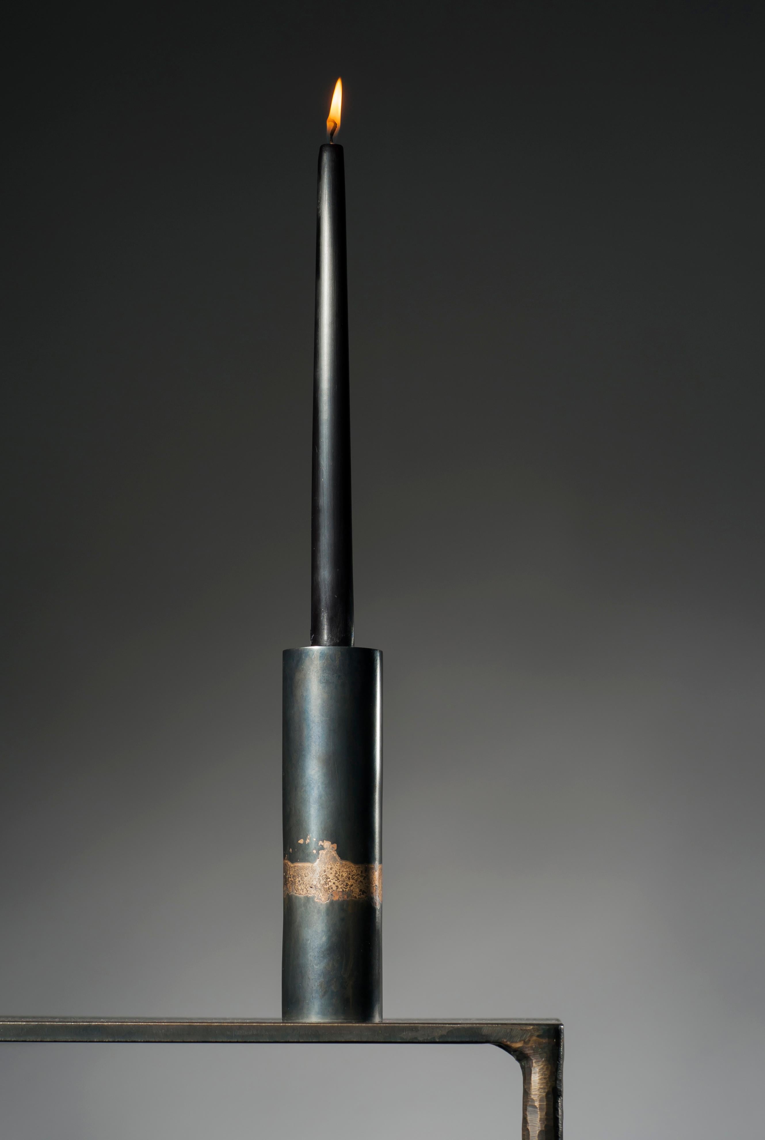 Steel candlestick by Lukasz Friedrich
Dimensions: D 5 x H 18 cm
Materials: Black patina on steel, bronze detail.