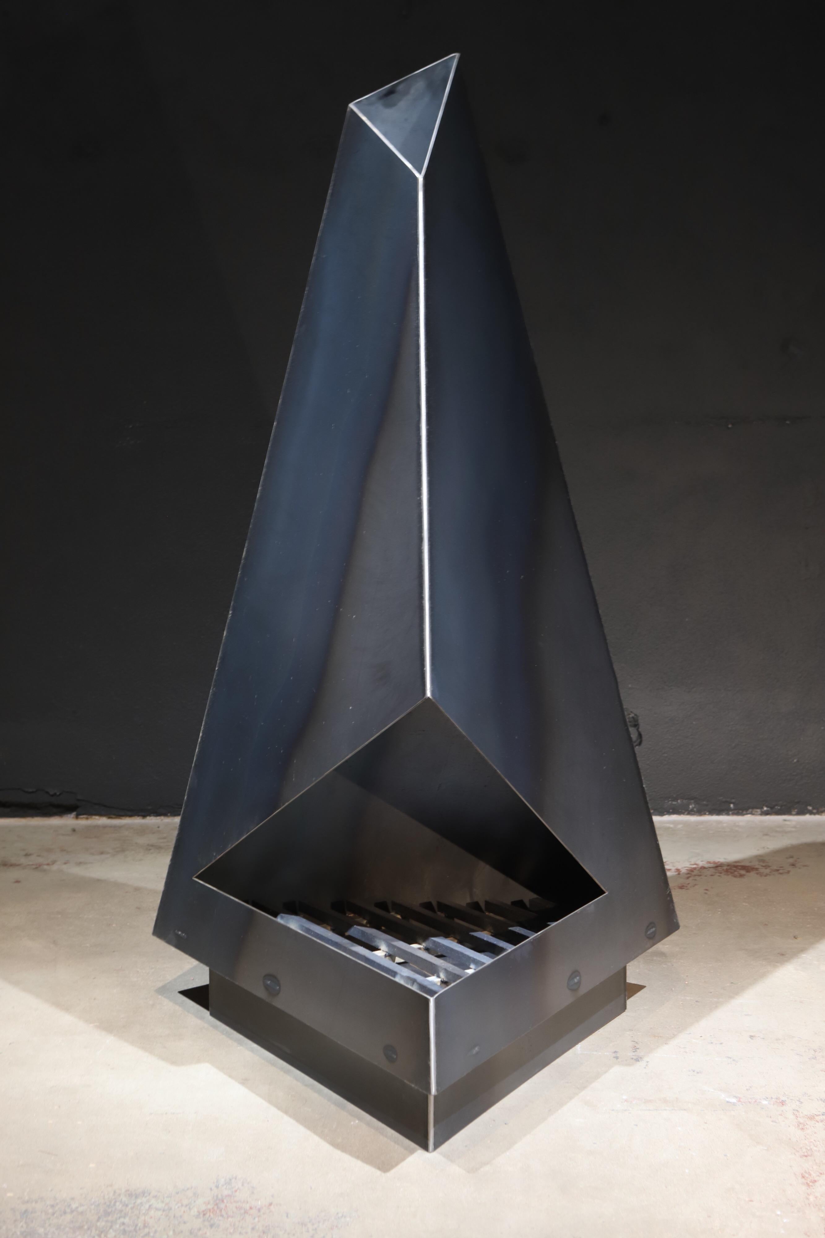 Not your normal chiminea or fireplace. This high design, raw steel sculptural piece will make a statement in any outdoor space. Functionally, it is perfect on that cold evening, but also serves as an amazing art display the remainder of the year.
