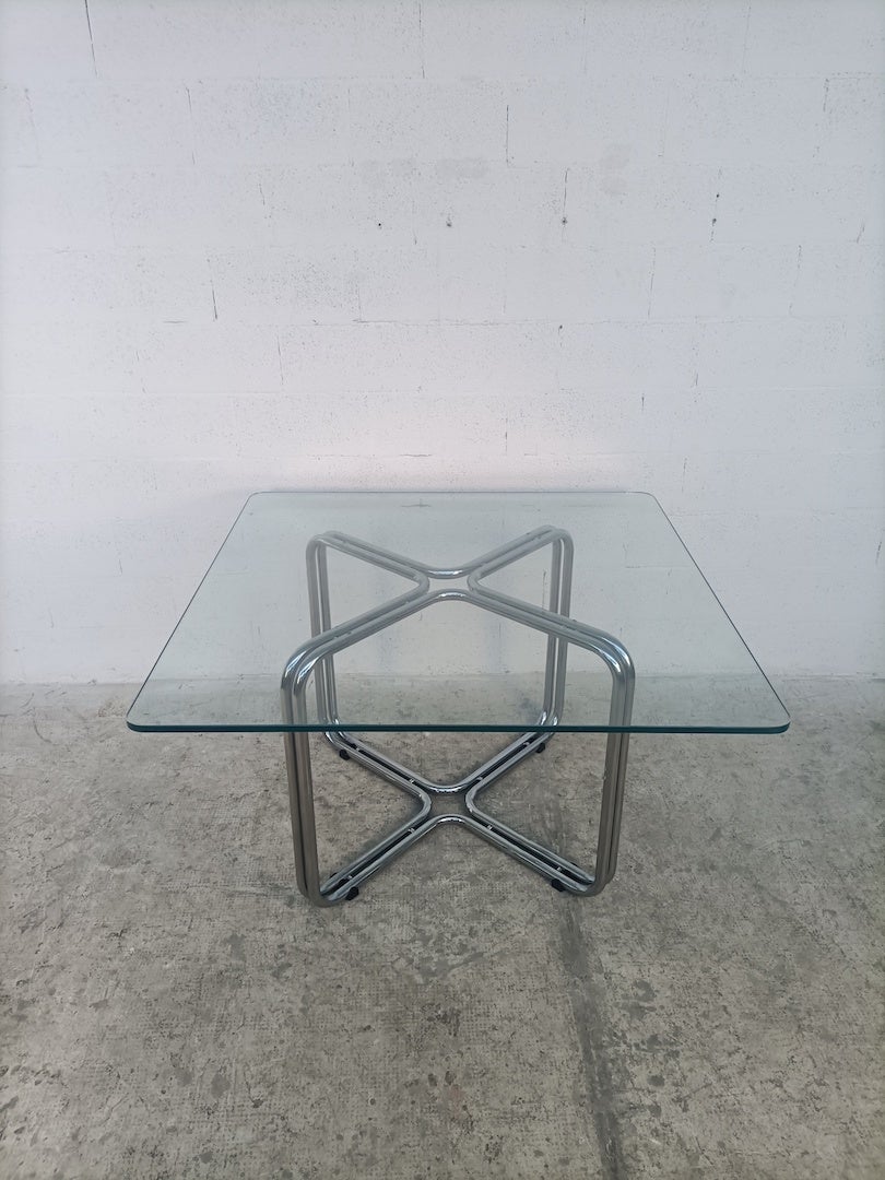 Steel chromed and glass squared table by Gastone Rinaldi for Rima 60s

Gastone Rinaldi was born in Padua in 1920. He initially worked for the Rima company founded by his father Mario Rinaldi in 1916.
In his work as a designer he was able to come