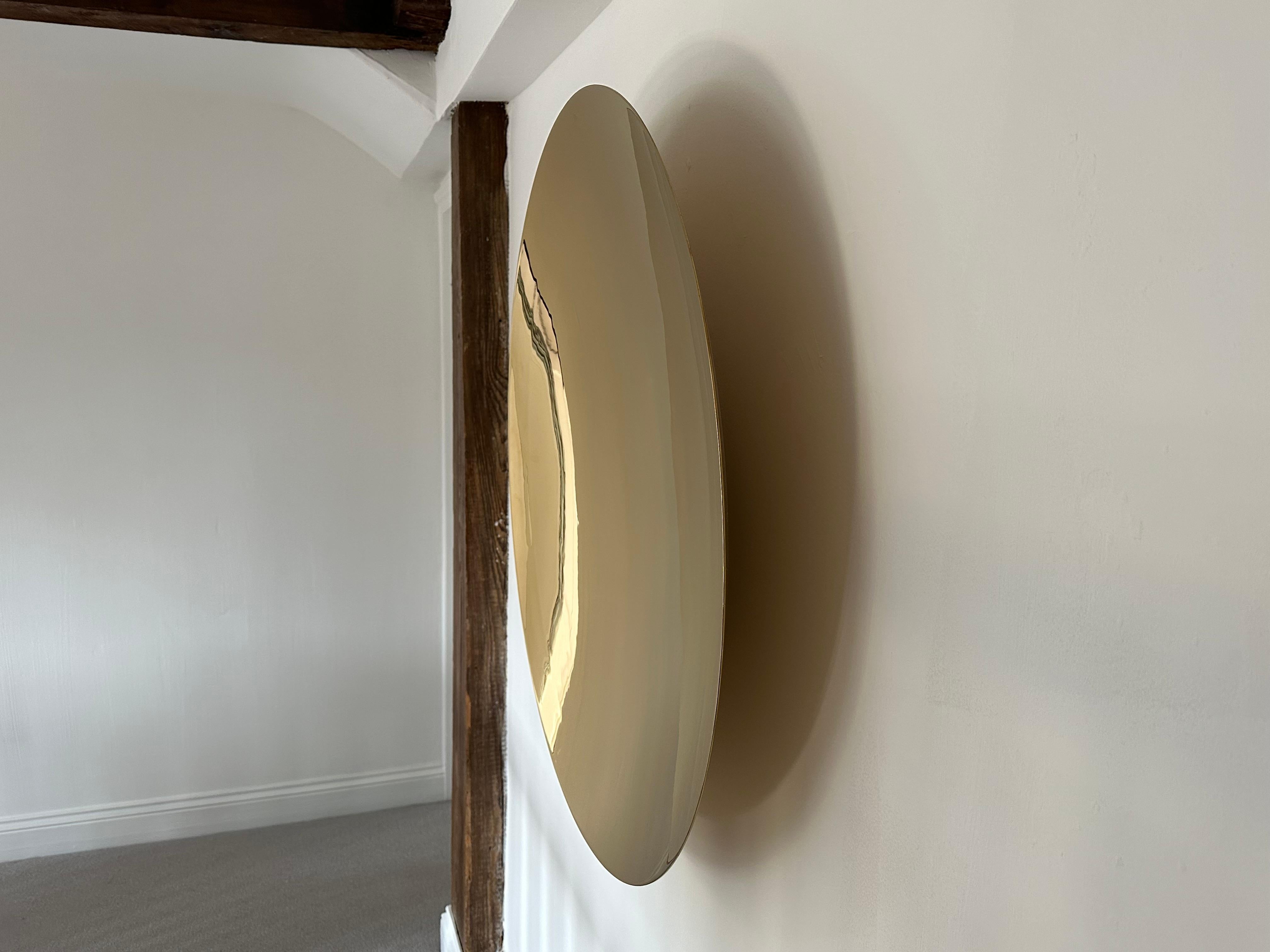 The concave mirror itself creates unique bright reflections which in turn creates the illusion of space. Please note that the image is upside down.

The mirror is fabricated out of 3mm 304 stainless steel. It's formed and then polished. After