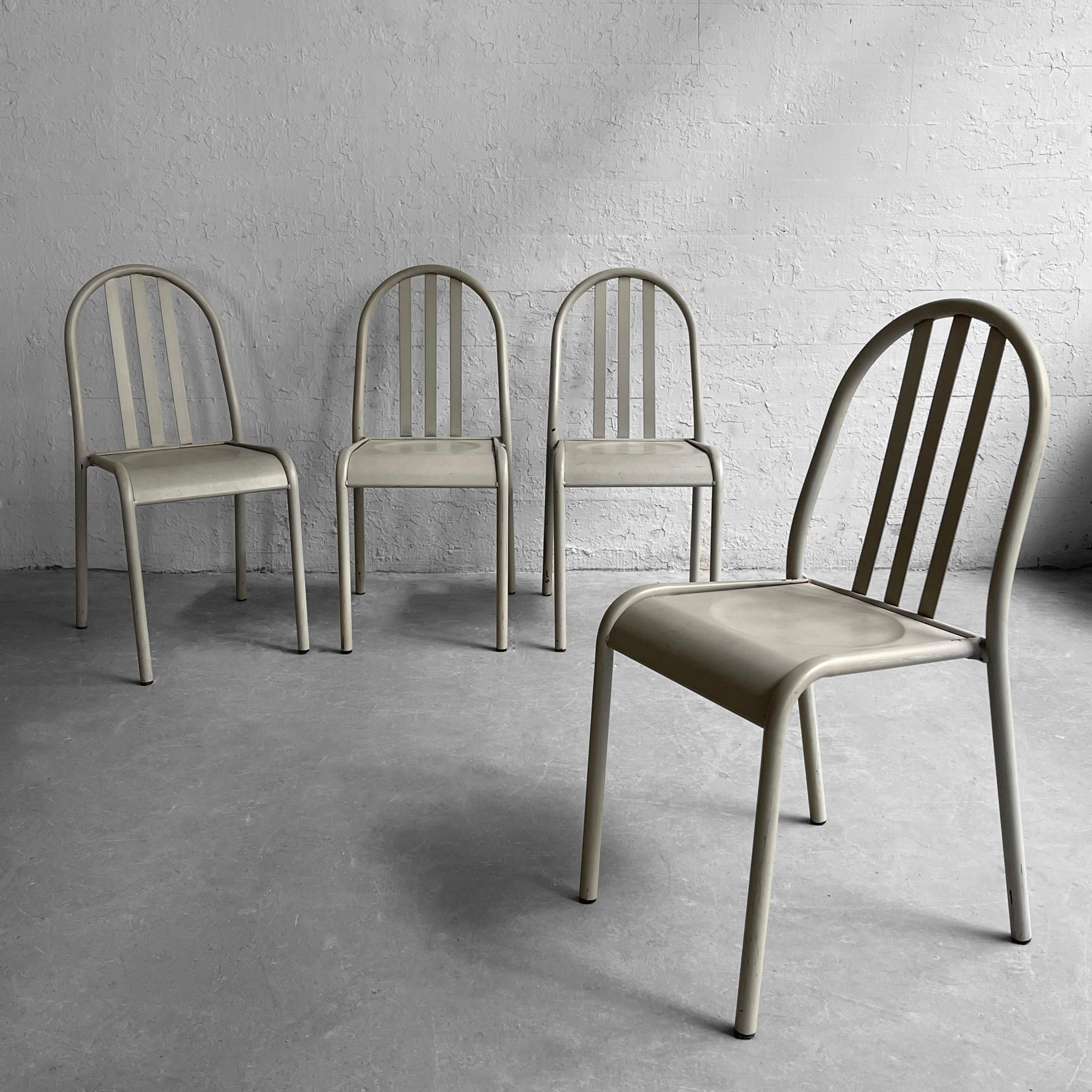 Set of 4, post modern, gray metal, dining or side chairs in the style of Robert Mallet-Stevens feature tubular frames, slat backs and contoured seats.