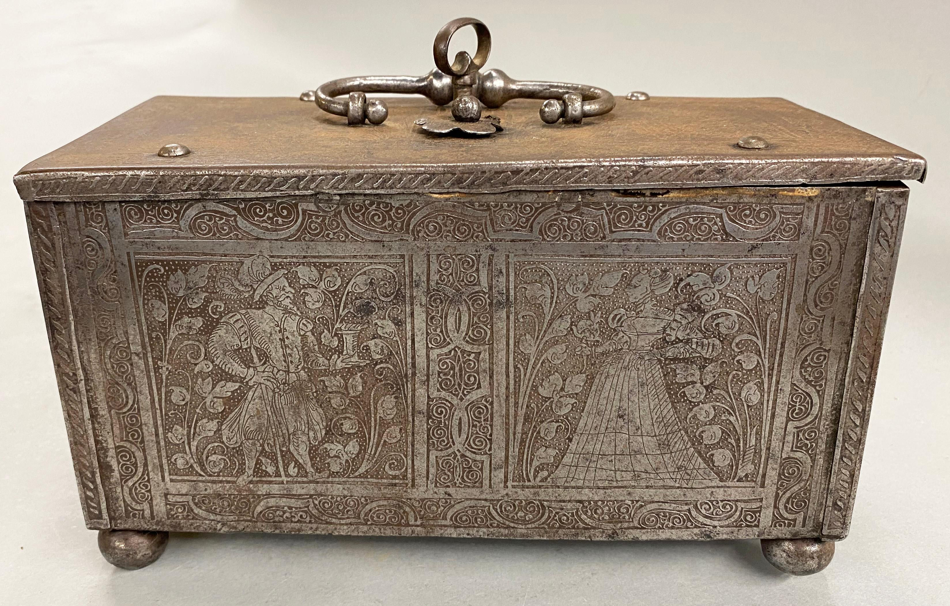 A fine example of a money chest or cash box with steel engraved figures on each side and an intricate locking mechanism under the lid, typical of metalwork coming out of a host of cities in southern Germany, Austria and Switzerland, renowned for
