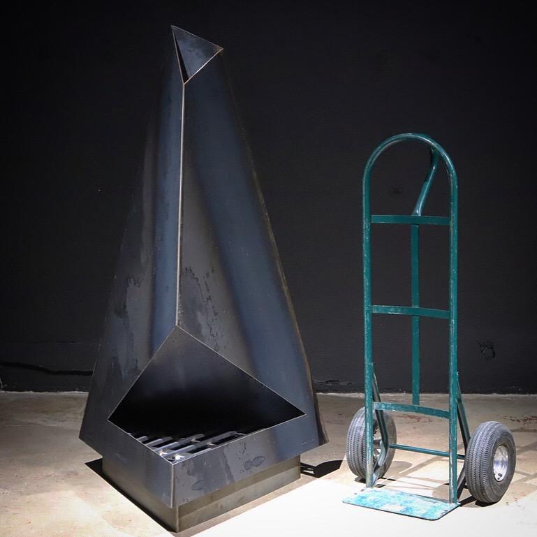 Not your normal chiminea or fireplace. This high design, raw steel sculptural piece will make a statement in any outdoor space. Functionally, it is perfect on that cold evening, but also serves as an amazing art display the remainder of the year.