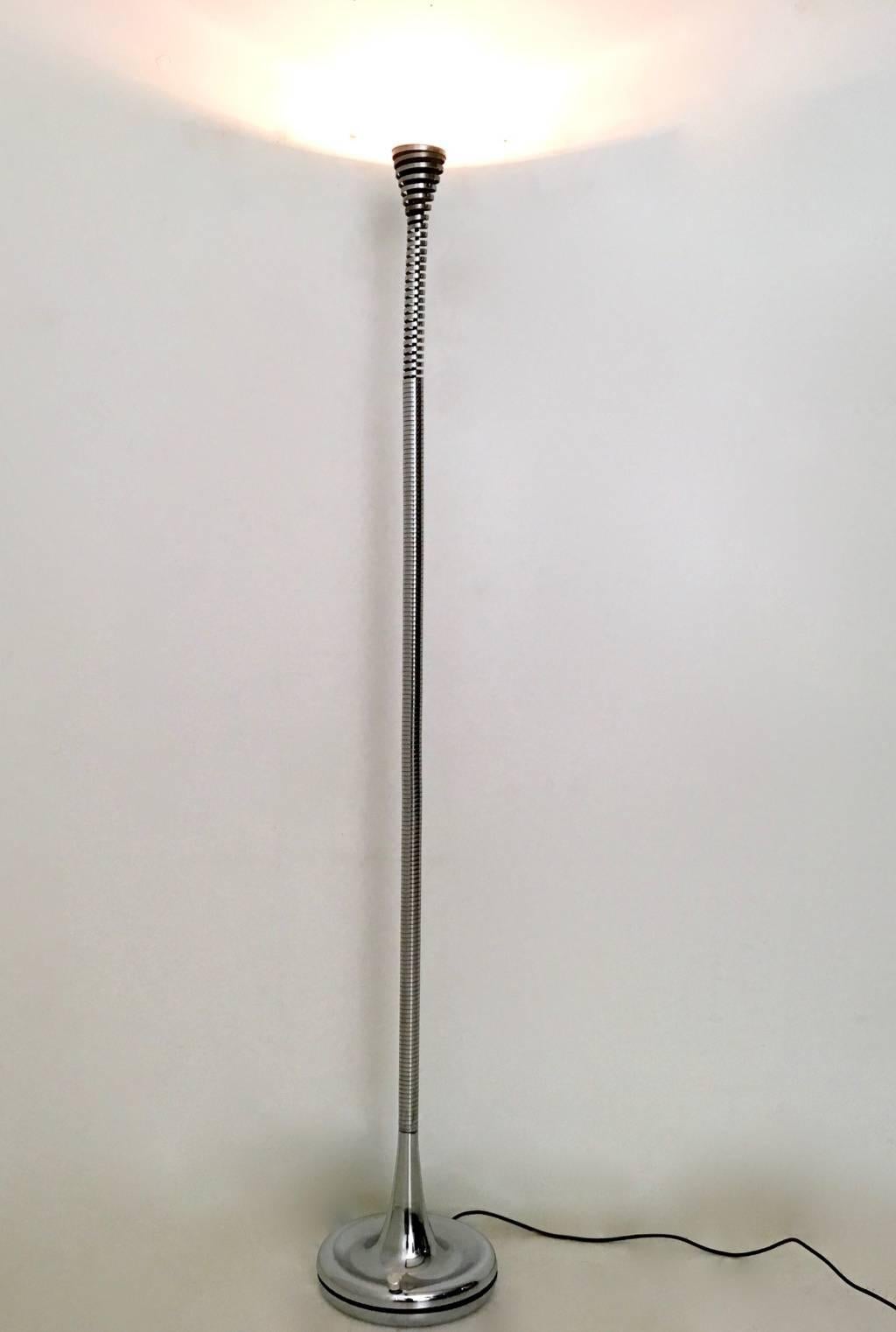 Made in Italy, 1970s.
This floor lamp features a steel stem with a spring design.
It is a vintage piece, therefore it might show slight traces of use, but it can be considered as in excellent original condition and ready to give a beautiful ambiance