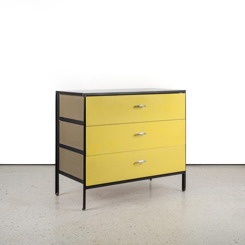 Offered For Sale Is A Pair Of Circa 1950'S Mid-Century Modern Three-Drawer Chests From The Steel Frame Series By George Nelson For Herman Miller. These Brightly Colored Chests Are Painted In Yellow With Black Enameled Metal Frames And khaki Enameled