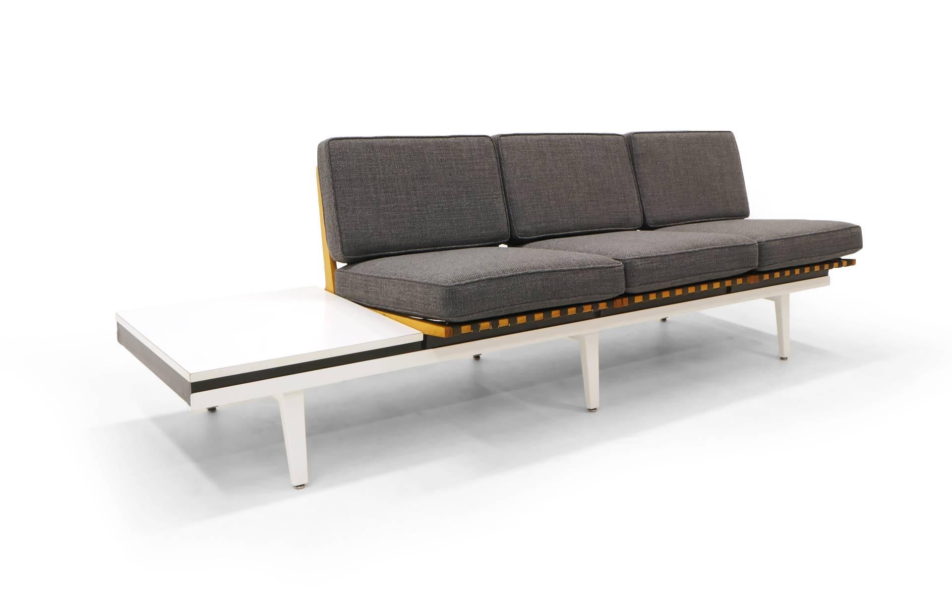 George Nelson Steel Frame Group modular sofa, coffee table and bench. Rare version with the folding birch seat frames. Seats and tables lift out of the frames and can be configured in any number of arrangements. Original white Formica tables tops