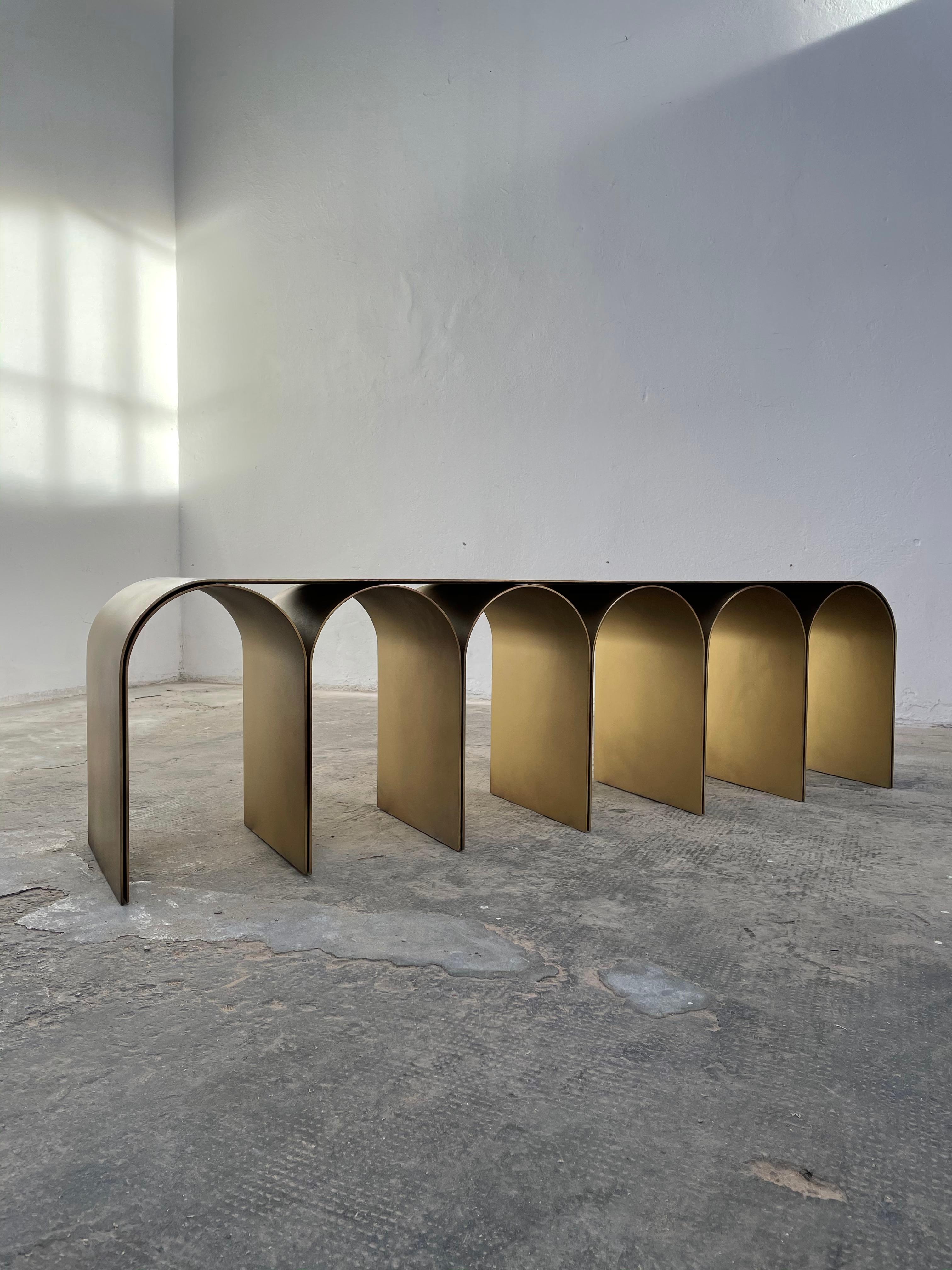 Steek gold arch bench by Pietro Franceschini
Sold exclusively by Galerie Philia
Materials: Steel
Finishes available: Brass finish, satin, blackened
Dimensions: W 155 x L 33 x 43cm
Manufacturer: Prinzivalli

Also available in steel brass