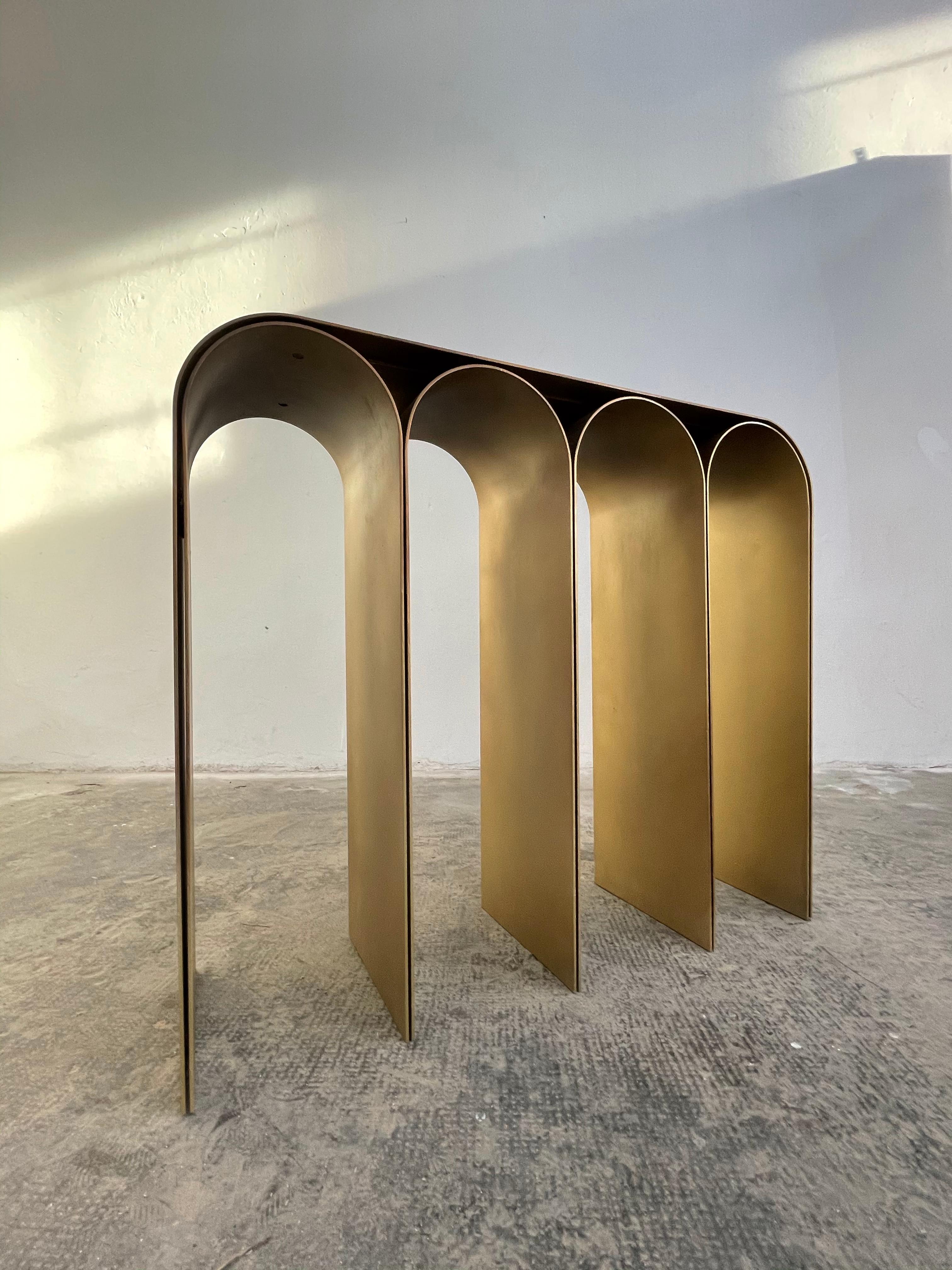 Steel gold arch console by Pietro Franceschini
Sold exclusively by Galerie Philia
Manufacturer: Prinzivalli
Dimensions: W 103 x L 30 x H 86 cm
Materials: steel (brass finish)
Other finishes: Satin, blackened, polished mirror

Also available:
Steel