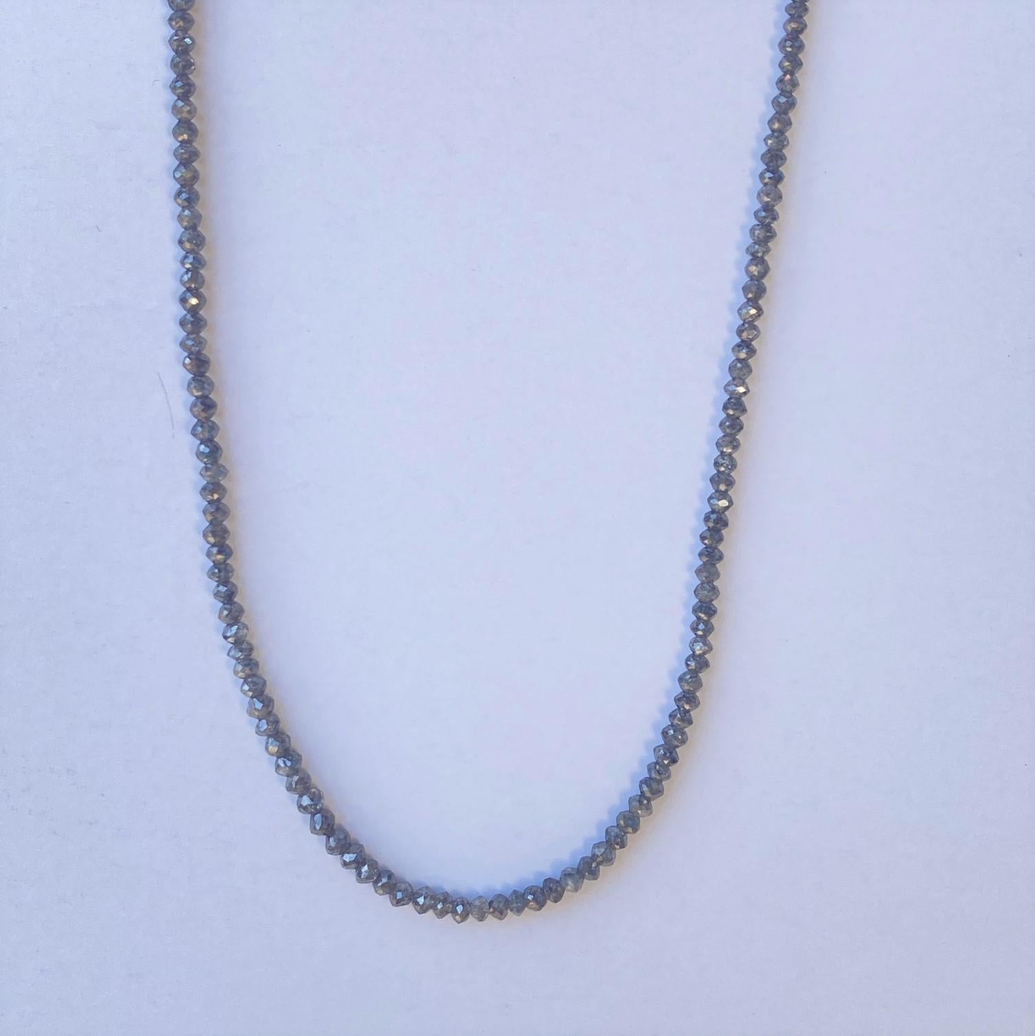 A 27.82ctw Steel Gray Faceted Rondell 17 inch diamond necklace with 14k or 18k white gold clasp parts. This necklace was made and designed by llyn strong.