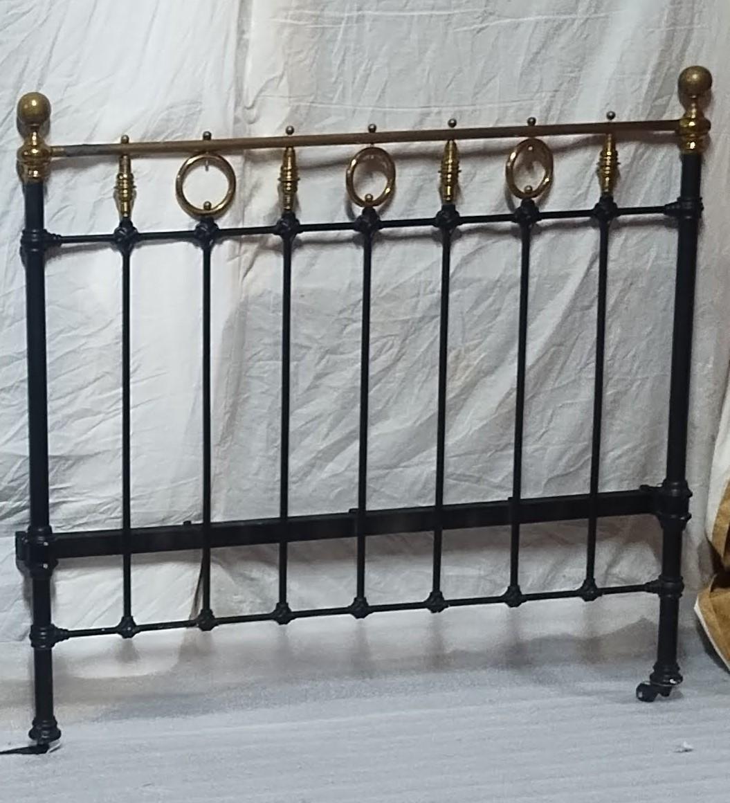 Steel Headboard
This steel headboard combines durability and vintage elegance with its black-painted metal frame and brass accents. Featuring vertical bars and decorative cast iron joints, it offers both stability and classic charm. The brass