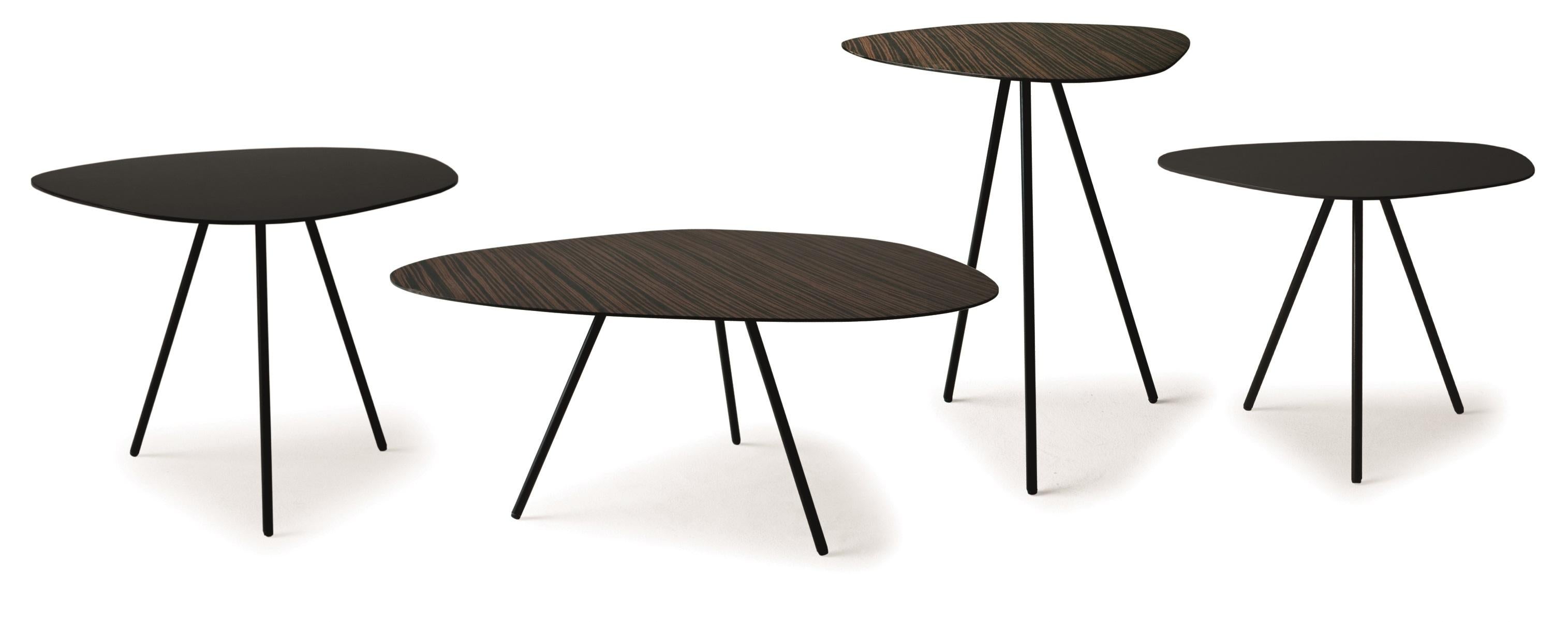 Steel high outdoor pebble end table by Kenneth Cobonpue.
Materials: Steel. 
Also available in other colors and for indoors.
Dimensions: 36 cm x 47 cm x H 50 cm 

Pebble playfully echoes shapes found in nature like stepping-stones in a riverbed