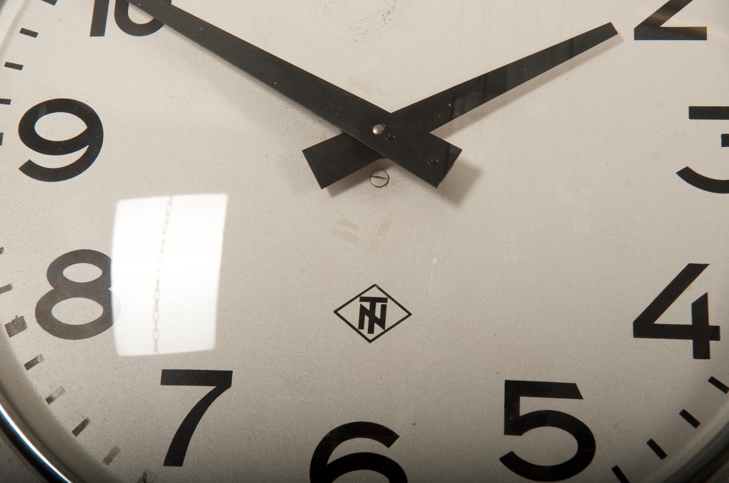 Steel painted clock, face with Arabic digits made in Germany in the 1950s, fitted with a modern quartz movement with a battery.