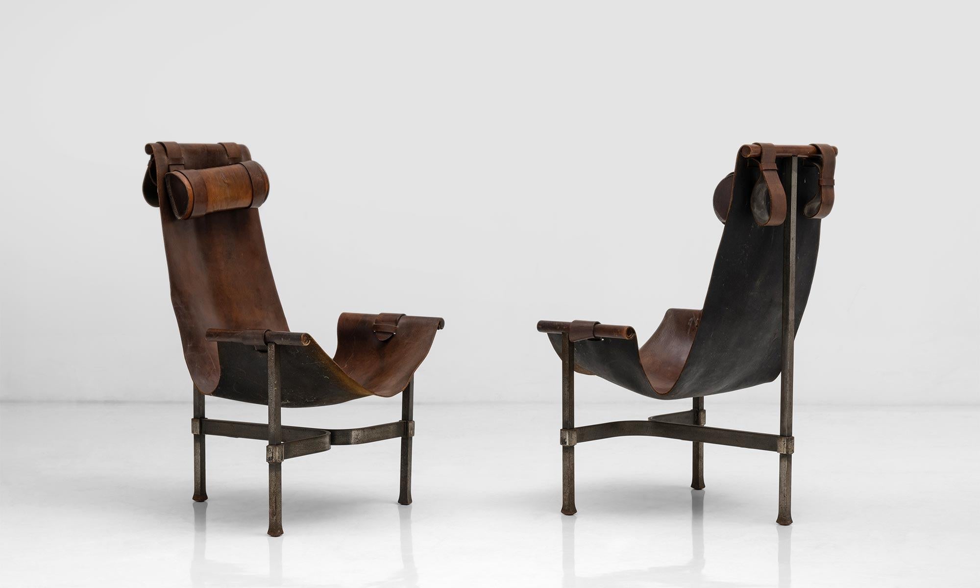 Steel & leather sling chairs,

Spain Circa 1960,

Steel frames in “T” arrangement and original thick leather seats,

Measures: 26” W x 26.5” D x 41.5” H x 13.5”seat x 22