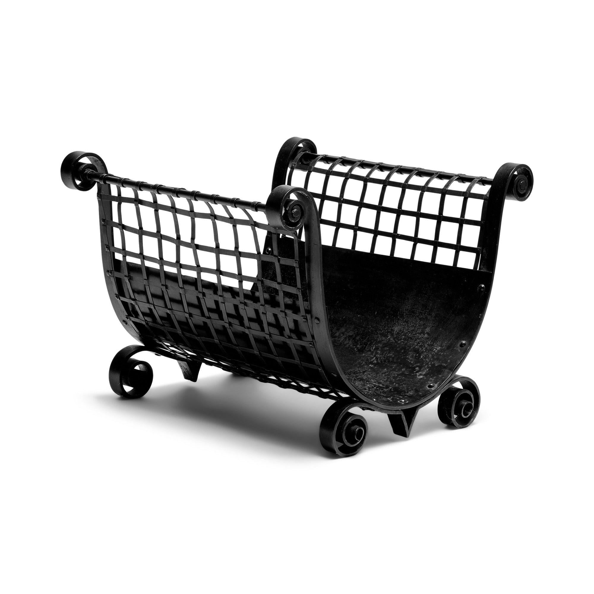 A patinated steel log basket with hand woven screen and scroll detail.