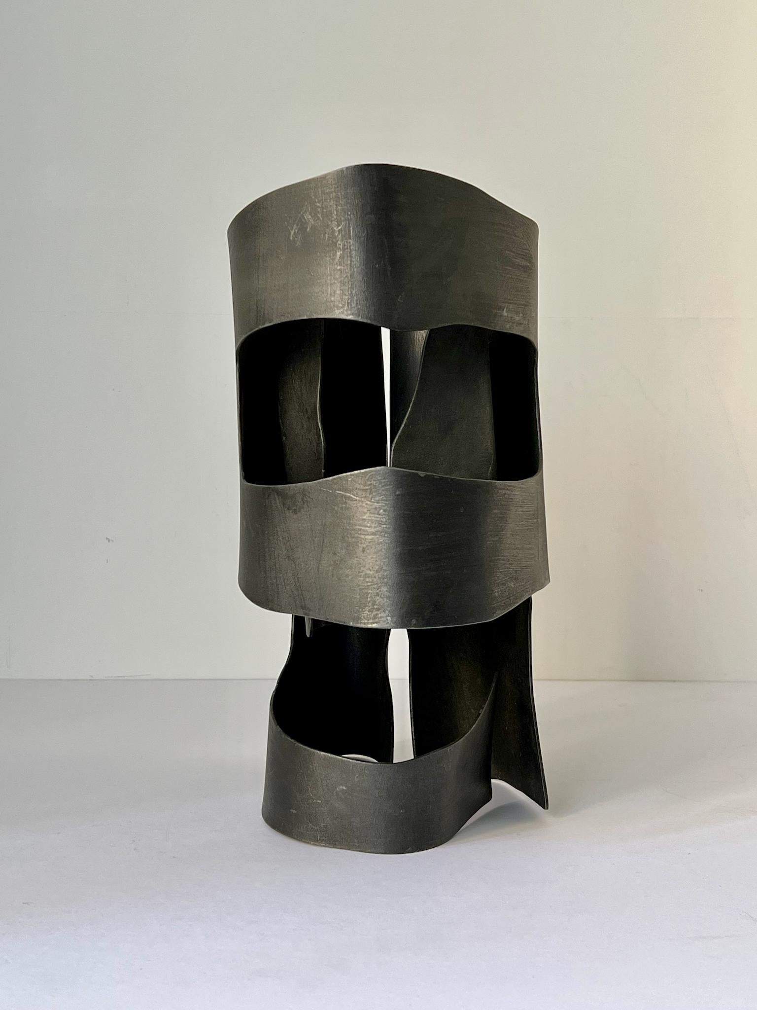 *Please contact us for availability of this item.*

Abstract steel sculpture, in the form of a helmet; from the estate of the artist June Barrington-Ward (1922-2002) and attributed to her. England 1970s. Unsigned.

Good original condition with some