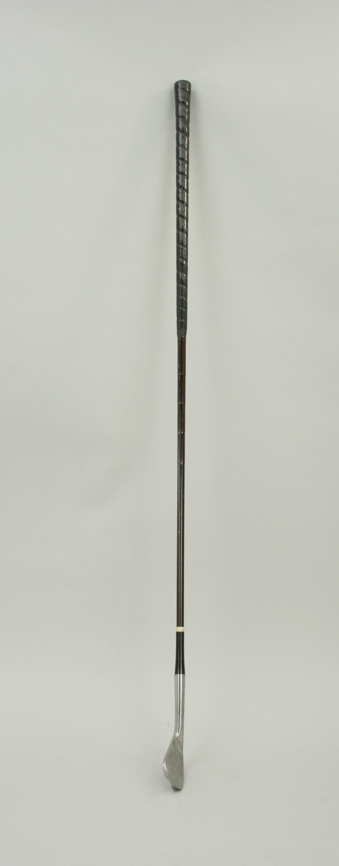 Steel shafted Tom Morris golf club.
An early steel shafted golf club, No. 4 iron, stamped Tom Morris, St Andrews. The club head has a curved hollowed back and is stamped 'Walker Cup Model' with no. 4 iron on the sole. It is with the original