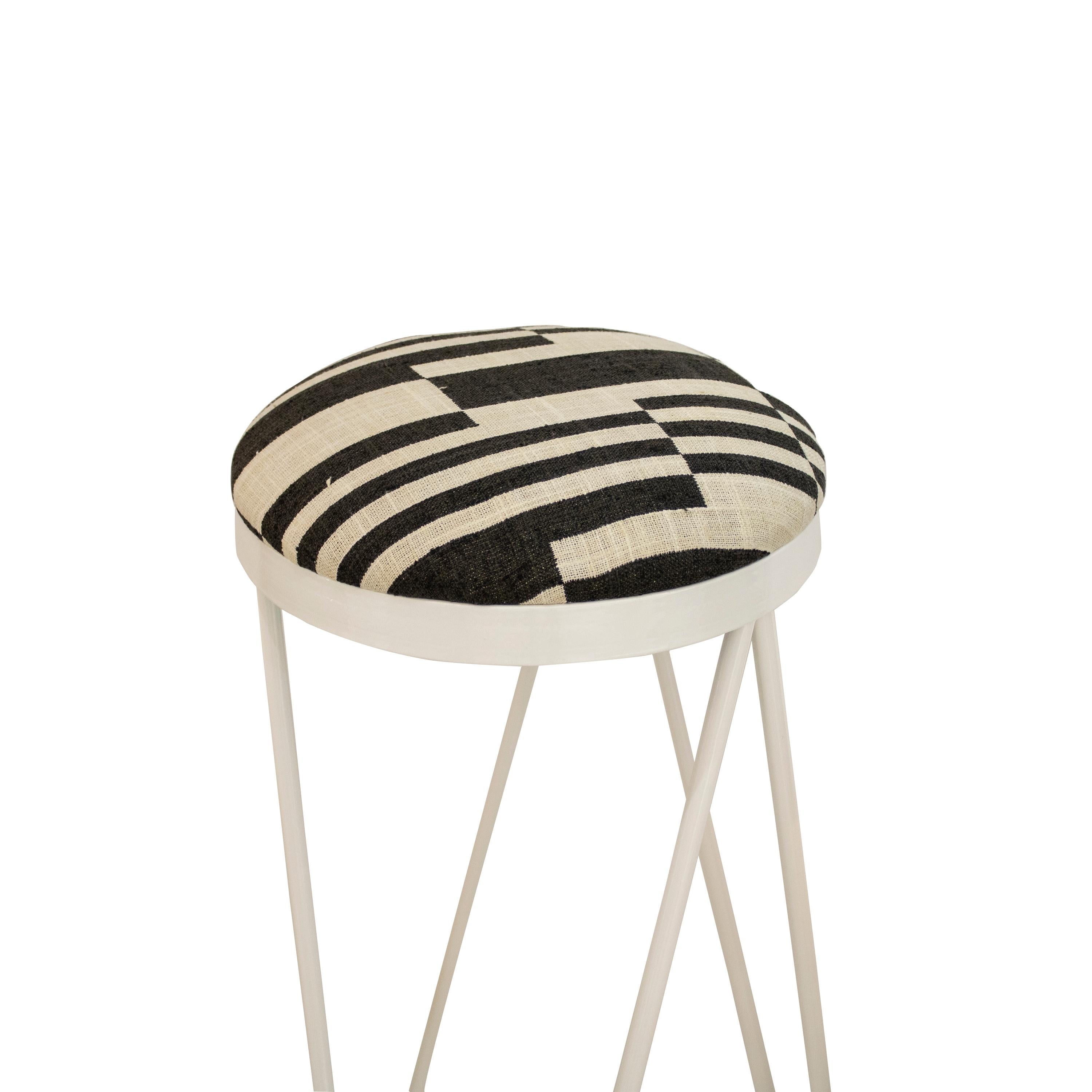 Contemporary bar stool designed by ikb191 studio in a limited edition. It consists of a white lacquered steel structure, and a foam seat, upholstered in black and white linen embroidered. Manufacture in Spain 2022.