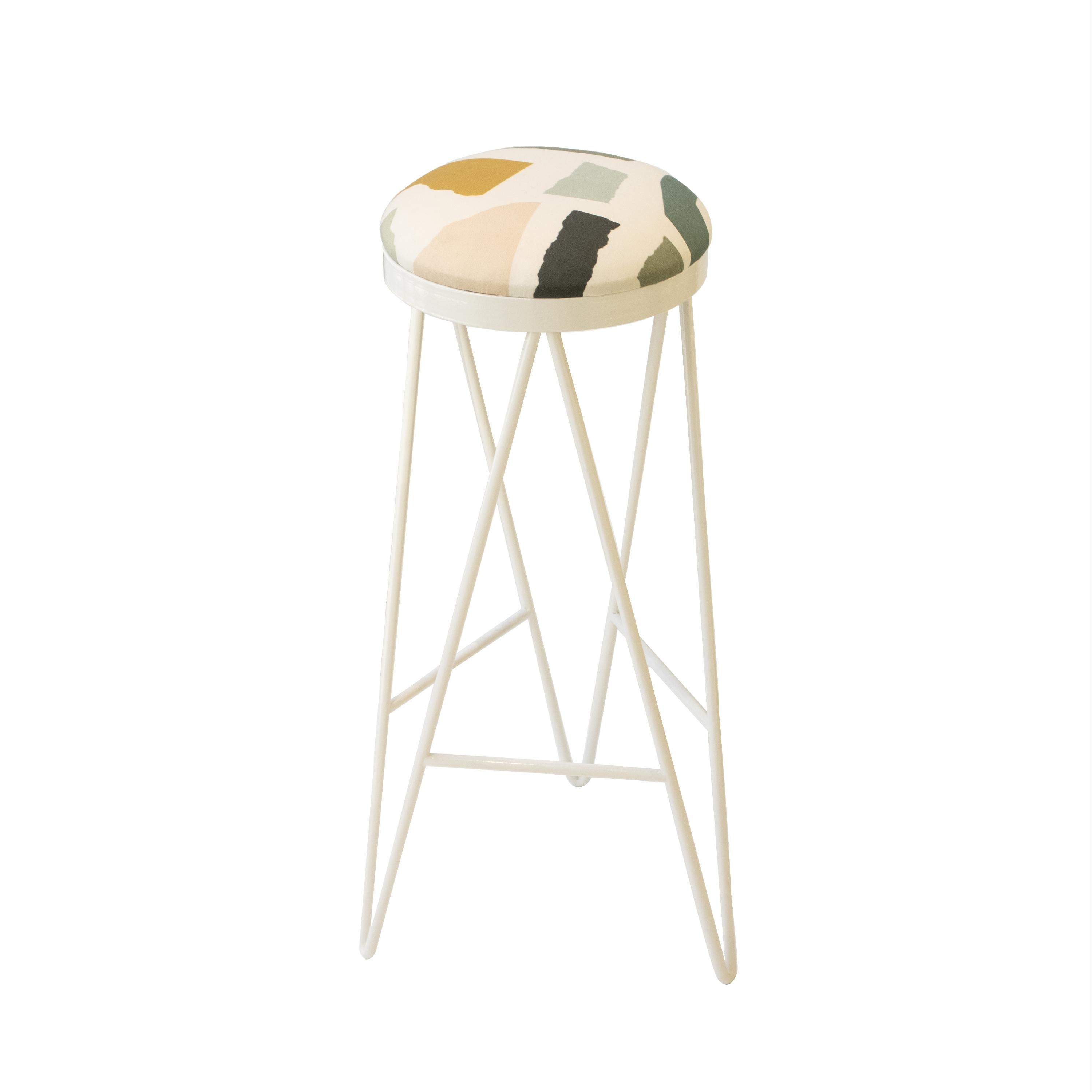 contemporary stool designed by IKB191 studio.  It consists of a Steel structure lacquered in white and a foam seat upholstered in beige cotton with a colorful Geometric Pattern. Manufacture in Spain 2022.