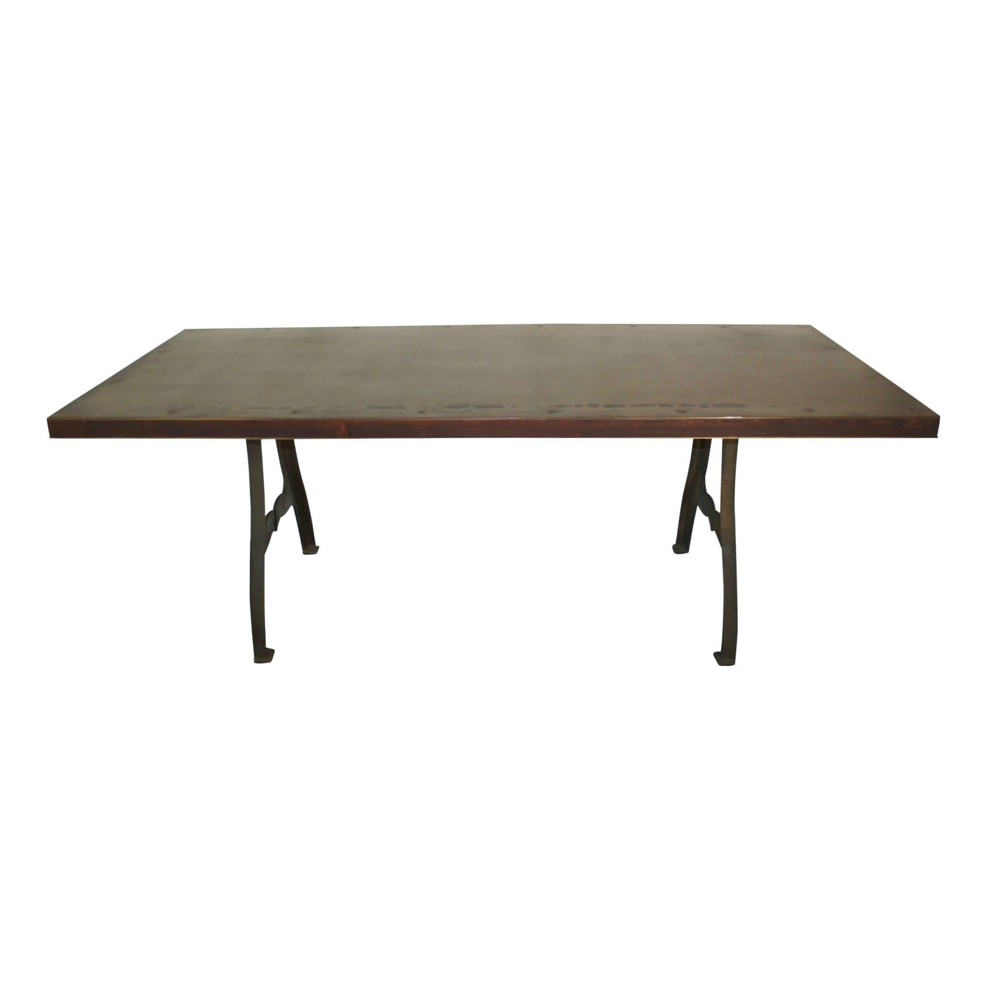 Fashioned from machine legs, reclaimed wood, and a steel top this no-nonsense, seven foot table is sure to please. The legs are cast iron reproductions of legs manufactured in New York during the 19th century. New York, N.Y. USA is embossed and