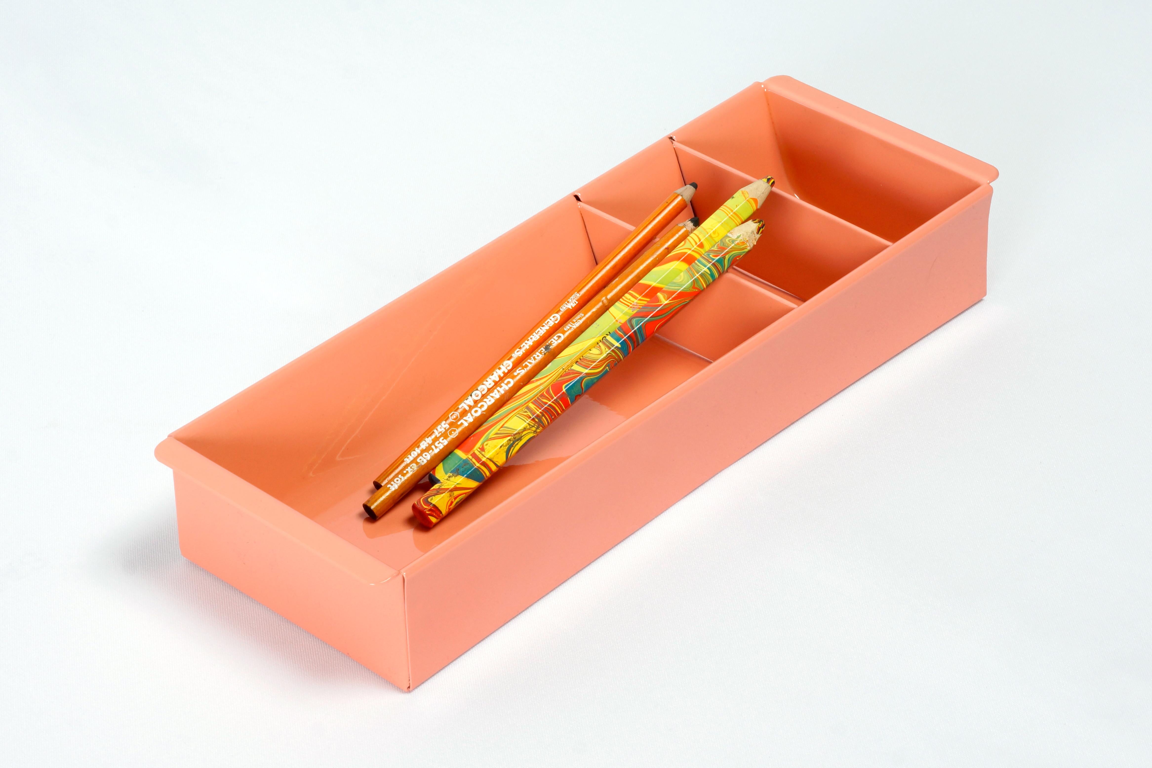 Once the insert to a Classic tanker desk's utility drawer, we repurposed this neat Industrial piece for use as a desktop organizer. Steel has been newly powder-coated in a pop of high gloss Peach. Features three slots, ideal for storing coins, pens