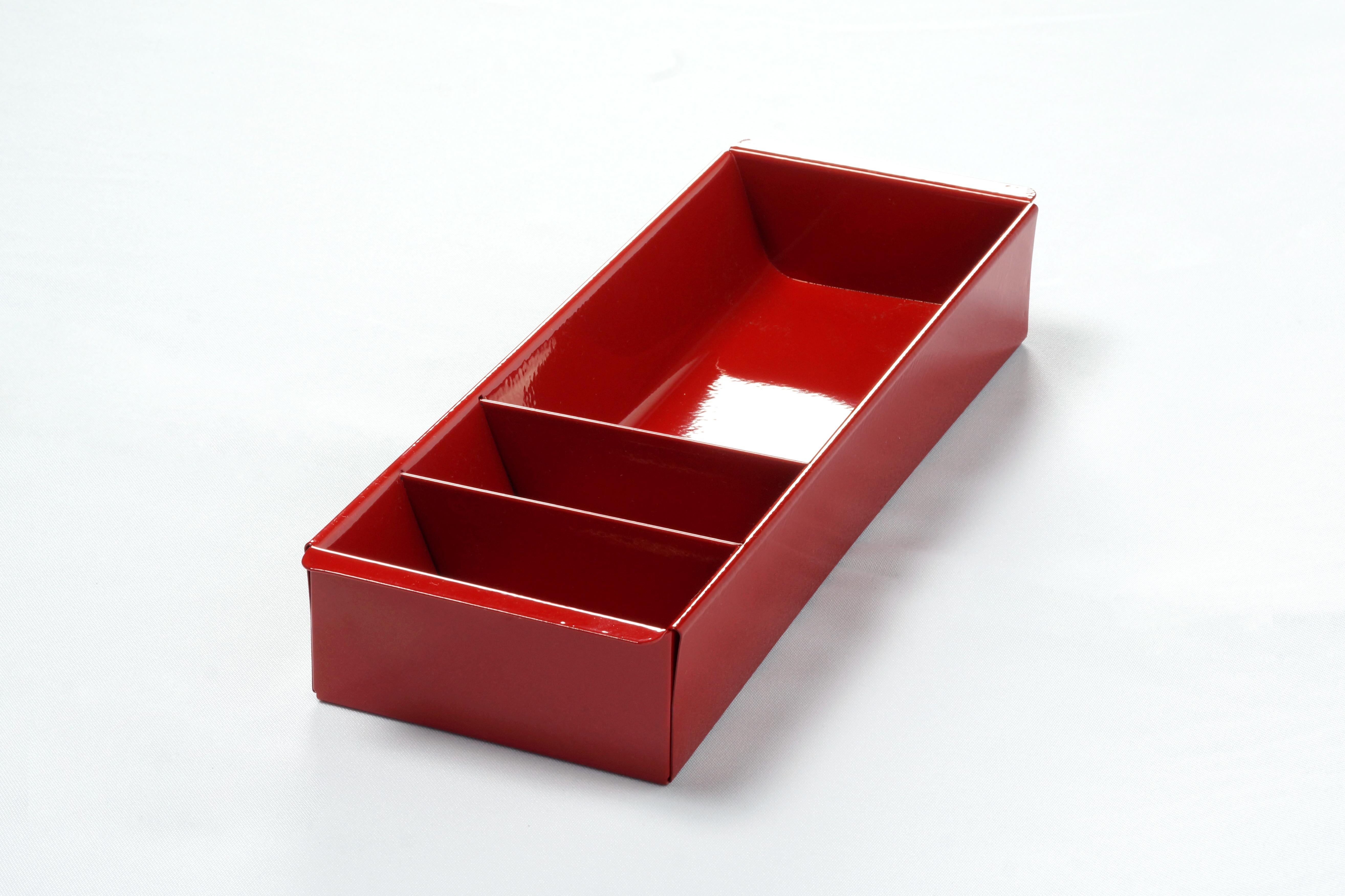 Once the insert to a classic tanker desk's utility drawer, we repurposed this neat Industrial piece for use as a desktop organizer. Steel has been newly powder-coated in a pop of high gloss ruby red (RD03). Features three slots, ideal for storing