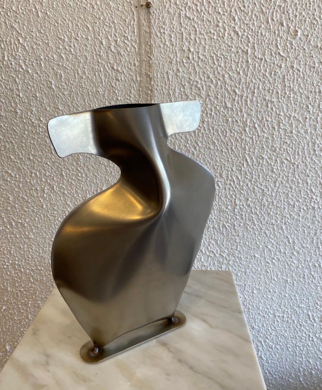 Steel Vase 1 by Duzi Objects 

Perth-based steel sculpture artist Douglas Powell of Duzi Objects delves into the realms of fluidity, movement, and three-dimensional shapes through his meticulously crafted steel sculptures. With a keen eye for detail