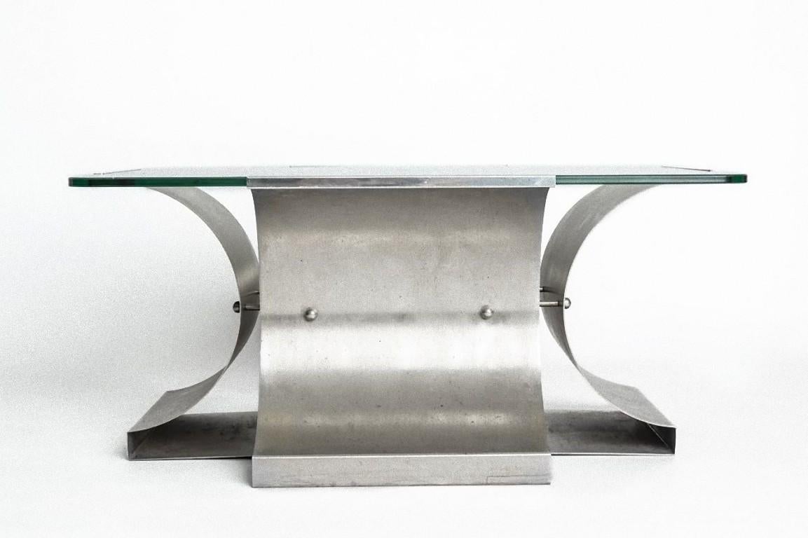 Steel vintage coffee table is a piece of original design furniture realized in the 1970s by Francois Monnet.

A very elegant steel table with a glass top.

This object is shipped from Italy. Under existing legislation, any object in Italy