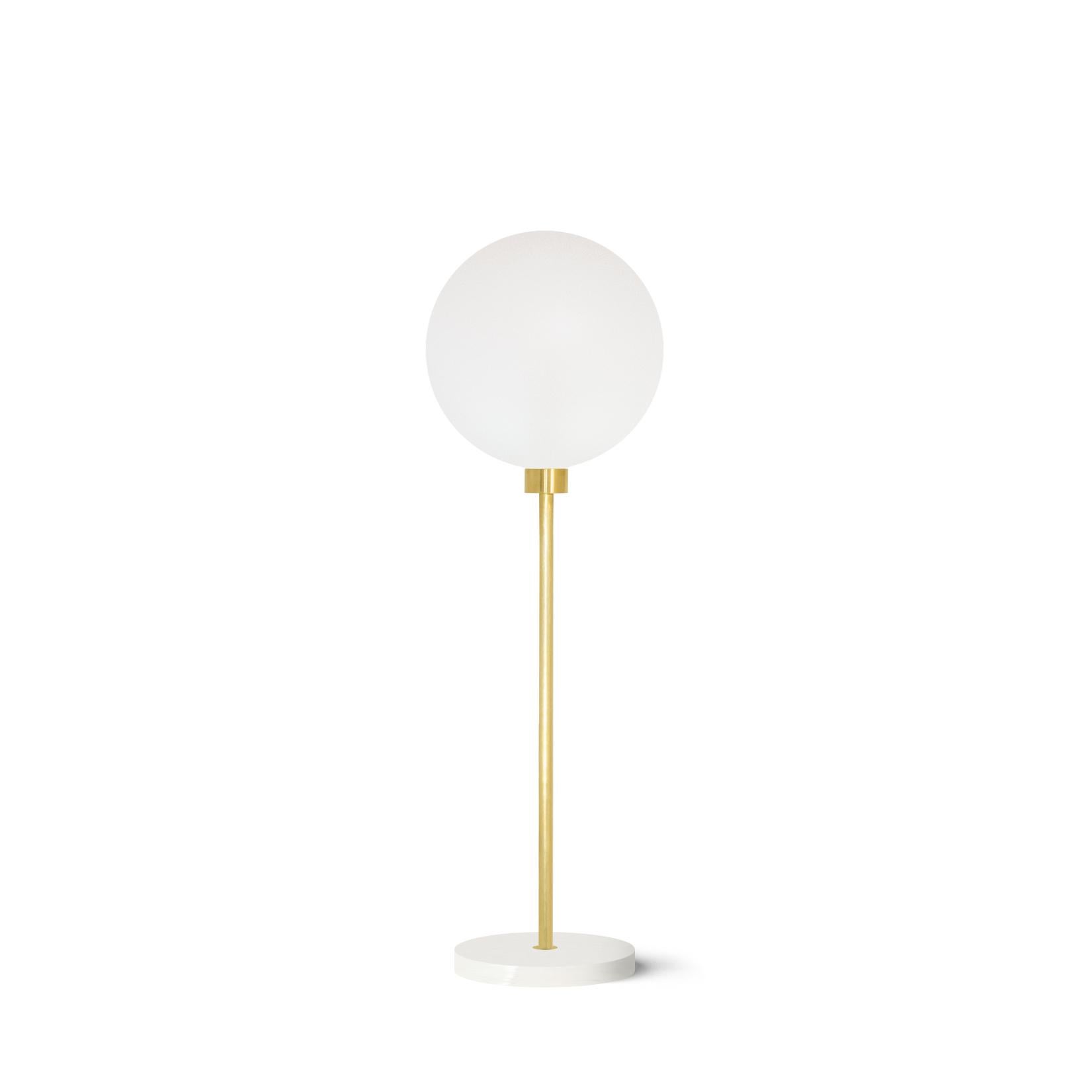 Steel/white marble verti table light by Atris
Materials: steel, white marble, satin glass
Also available in copper and brass.
Dimensions: H 66 x D 20 cm

We are the preachers of honest design, and we like to emphasize the beauty of natural