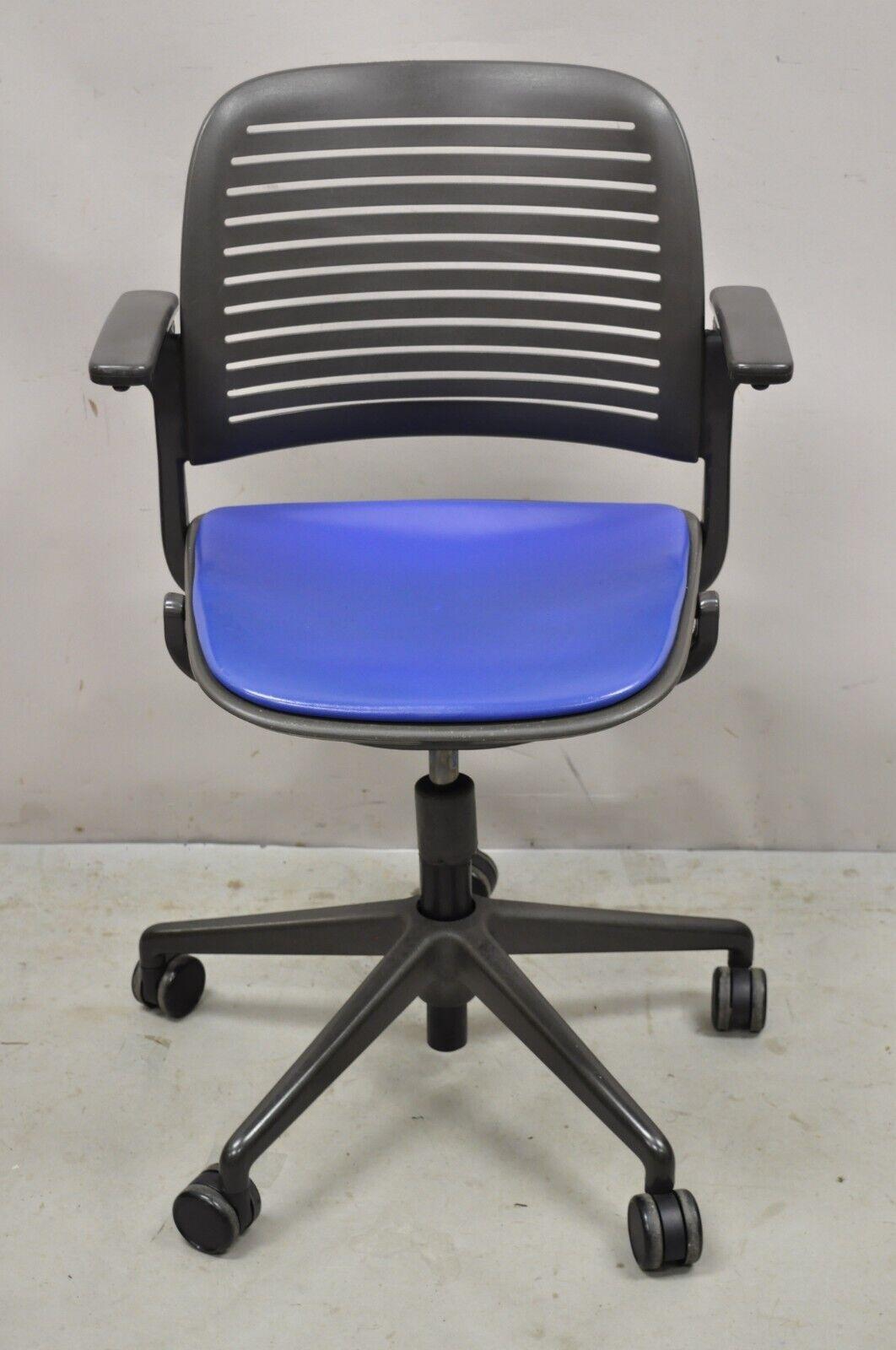 Steelcase 487 Cachet Swivel Office Desk Chair with Blue Seat. Item featured is adjustable in height, blue seat, rolling casters, lift up armrests, original label, great style and form. Measurements: 37