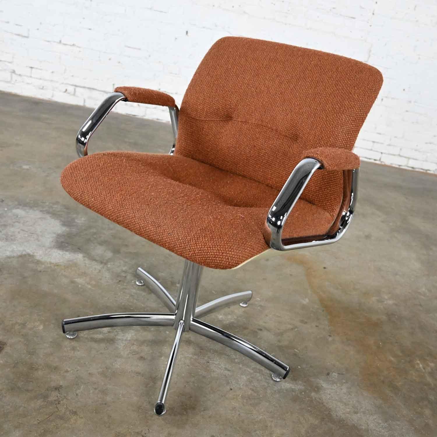 Handsome swivel chair by Steelcase model #454 in the style of Charles Pollock. Comprised of its original brown hopsack fabric, chrome shaft with swivel, chrome arms, and five prong chrome base. Beautiful condition, keeping in mind that this is