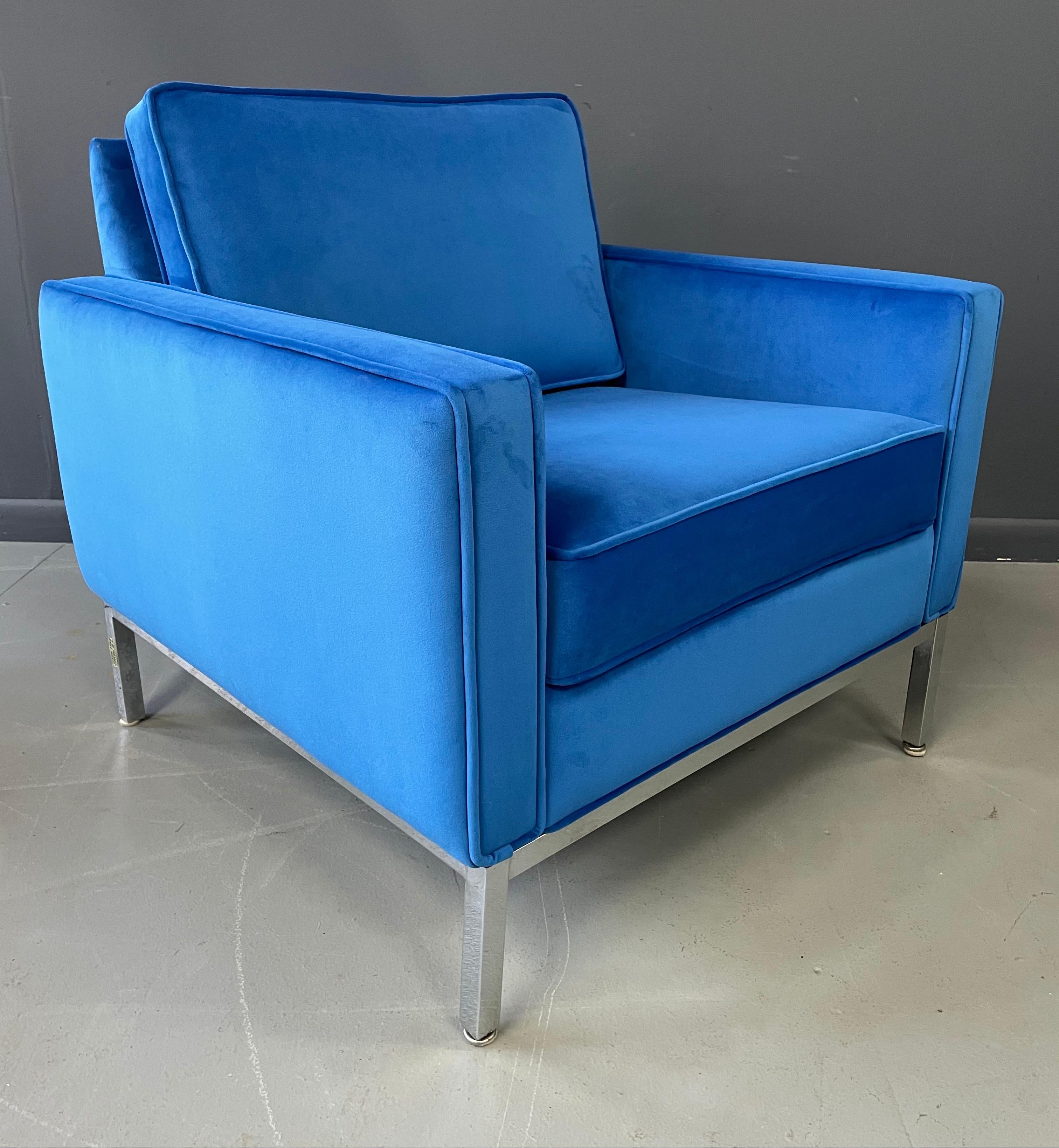 Beautiful lounge chair with generous proportions with a chromed steel frame and upholstered in a luscious blue velvet.