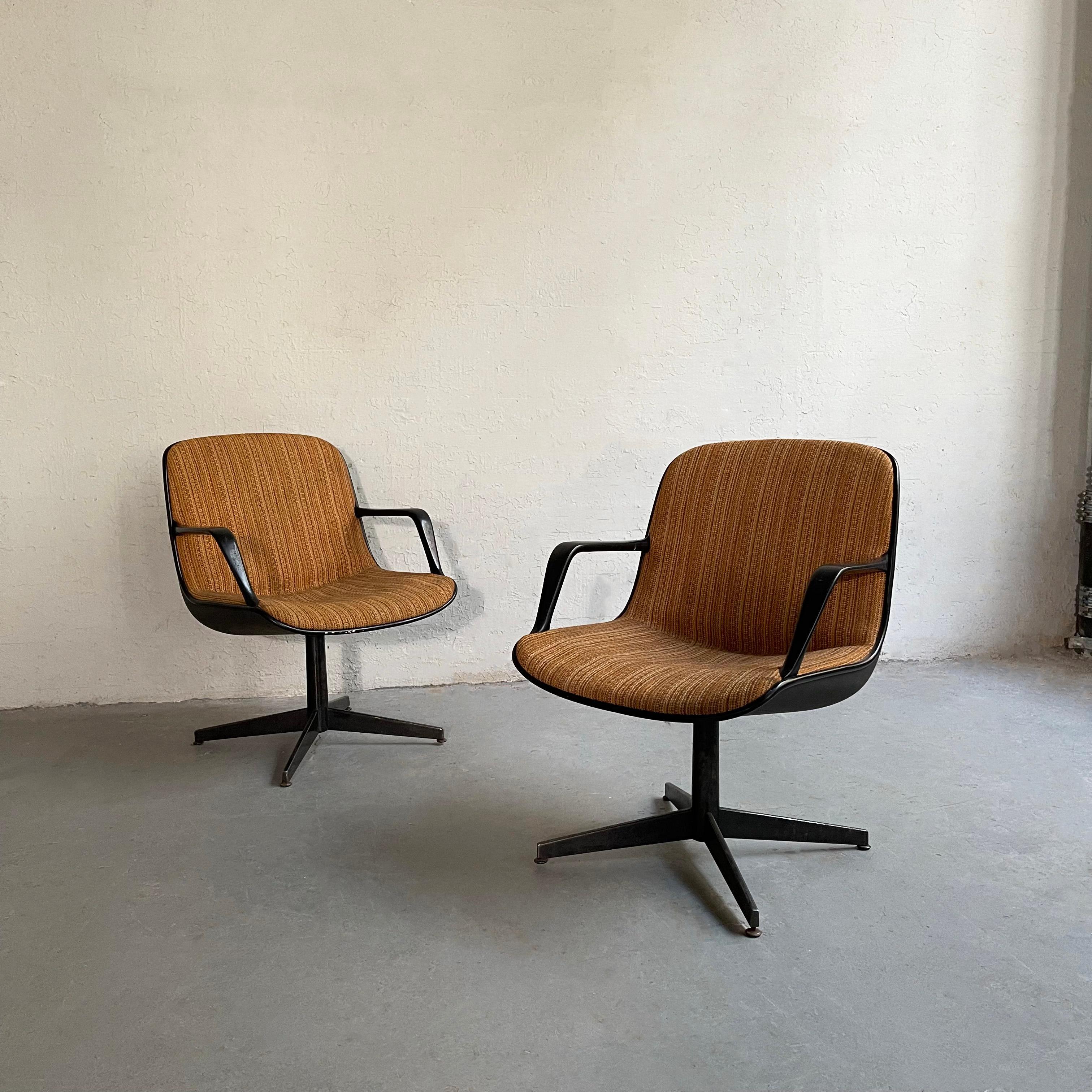 Pair of Steelcase armchairs, model #451 feature plastic shells, metal arms and 4 prong pedestal bases with striped fabric upholstery. The chairs are similar in style to the Charles Pollack, Knoll chair. Classic midcentury style with comfort, great