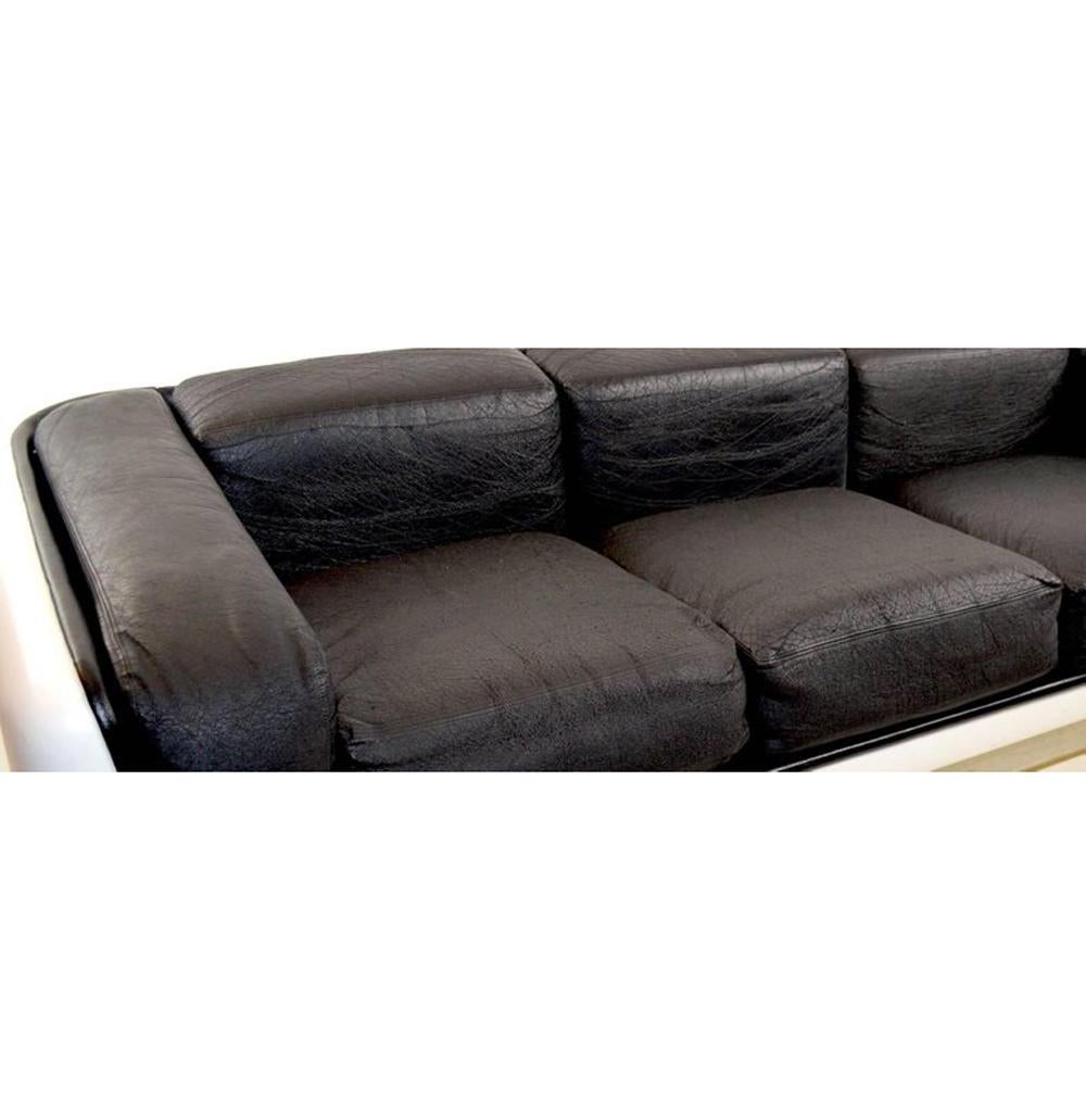 Sofa designed by William Andrus for Steelcase. White fiberglass frame black vinyl cushions, sofa shows minor cosmetic wear, age-appropriate. Seat H 18.

New leather on cushions upon purchase.