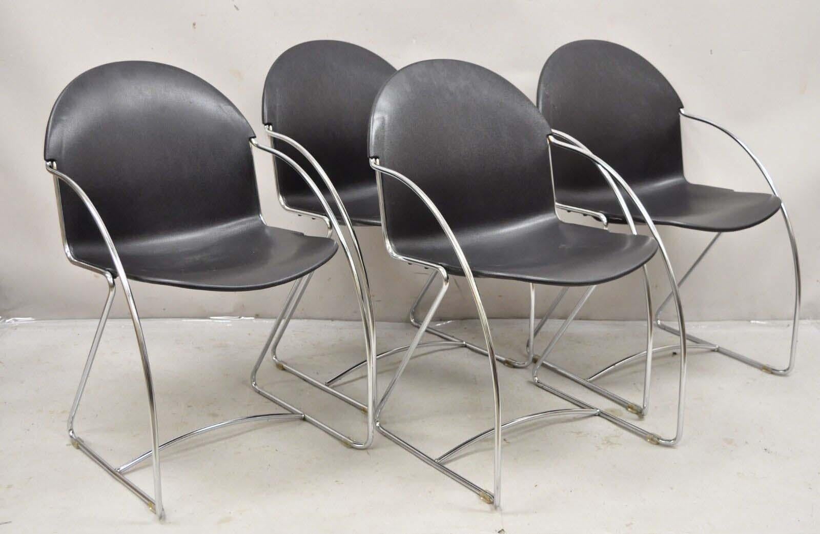 Steelcase Tom Grasman Chrome Frame Black Molded Plastic Stackable Chairs - Set of 4. Circa  1996. Measurements: 32