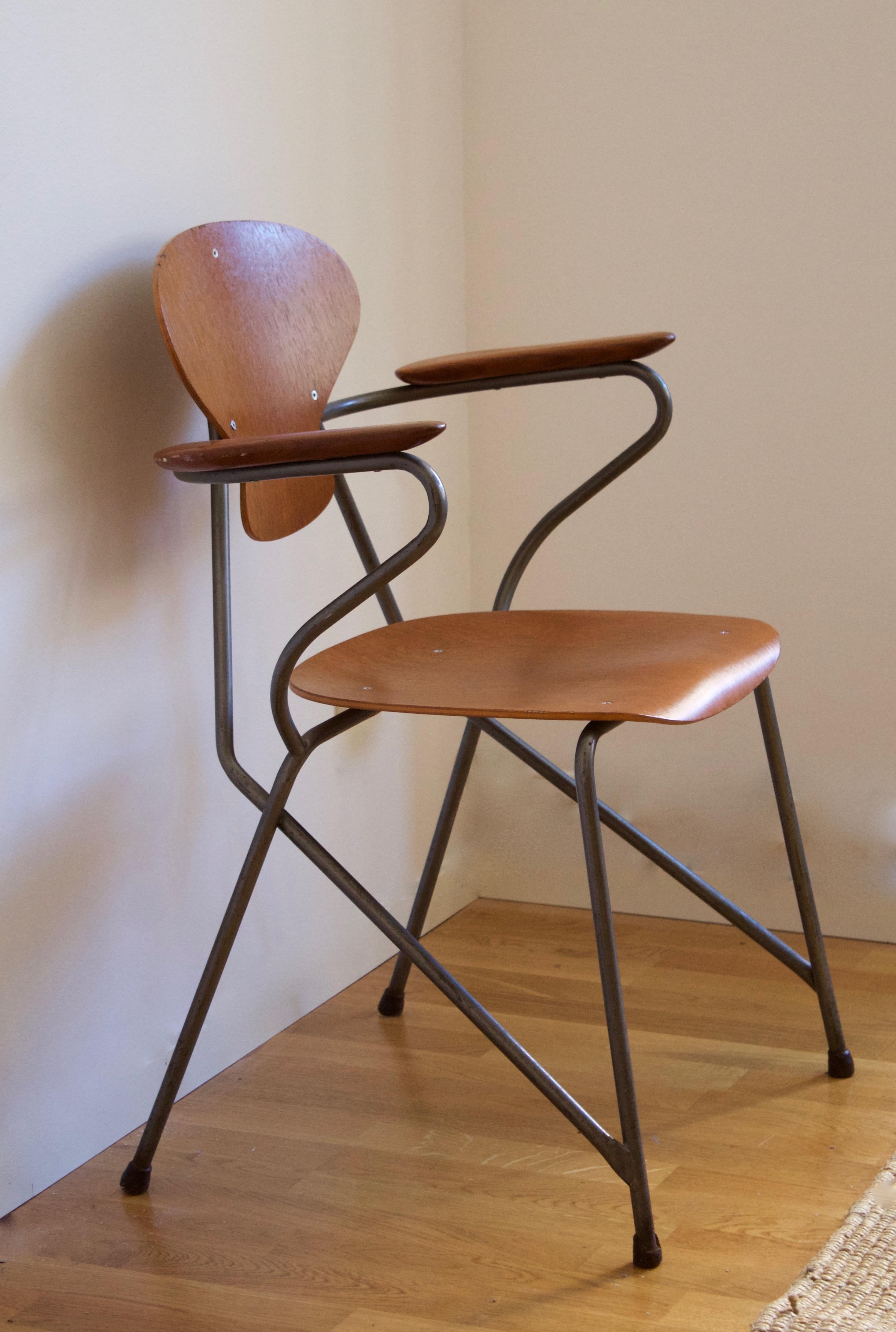 A rare armchair designed by important Danish architect Steen Eiler Rasmussen in partnership with product designer Kai Lyngfeldt Larsen. Designed for Rasmussens Rungsted Skole in 1954. Produced by Danbork.

Example from the original interior.