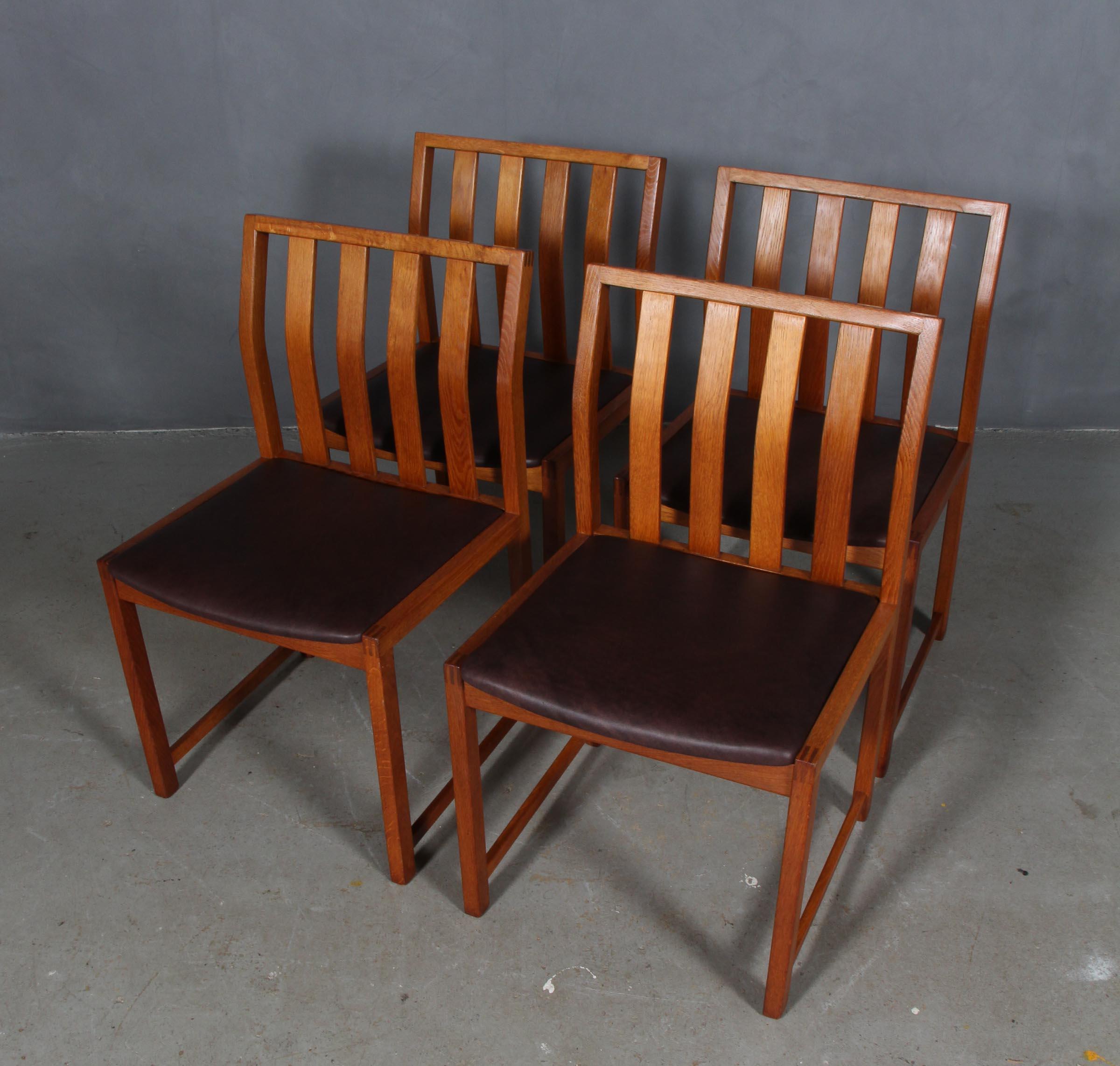 Steen Eiler Rasmussen set of four dining chairs in teak.

Seat new upholstered with mokka aniline leather.