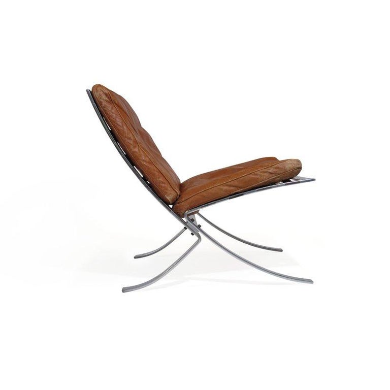 Mid-20th Century Steen Ostergaard Steel and Leather Lounge Chair and Foot Stool For Sale