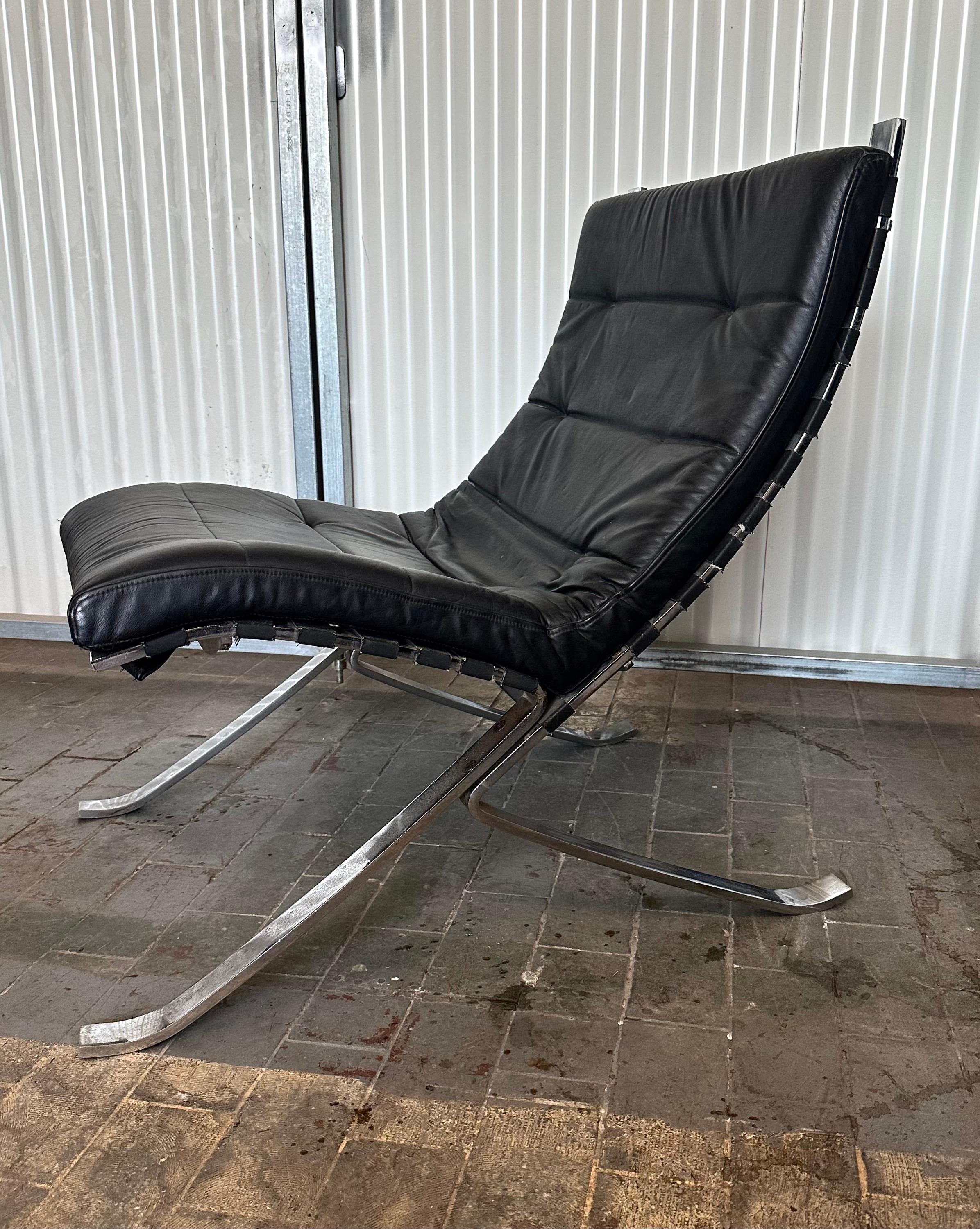 Heavy chromium-plated flat bar steel frame with leather cushion. Wonderful tribute to the Classic Mies van der Rohe Barcelona chair.