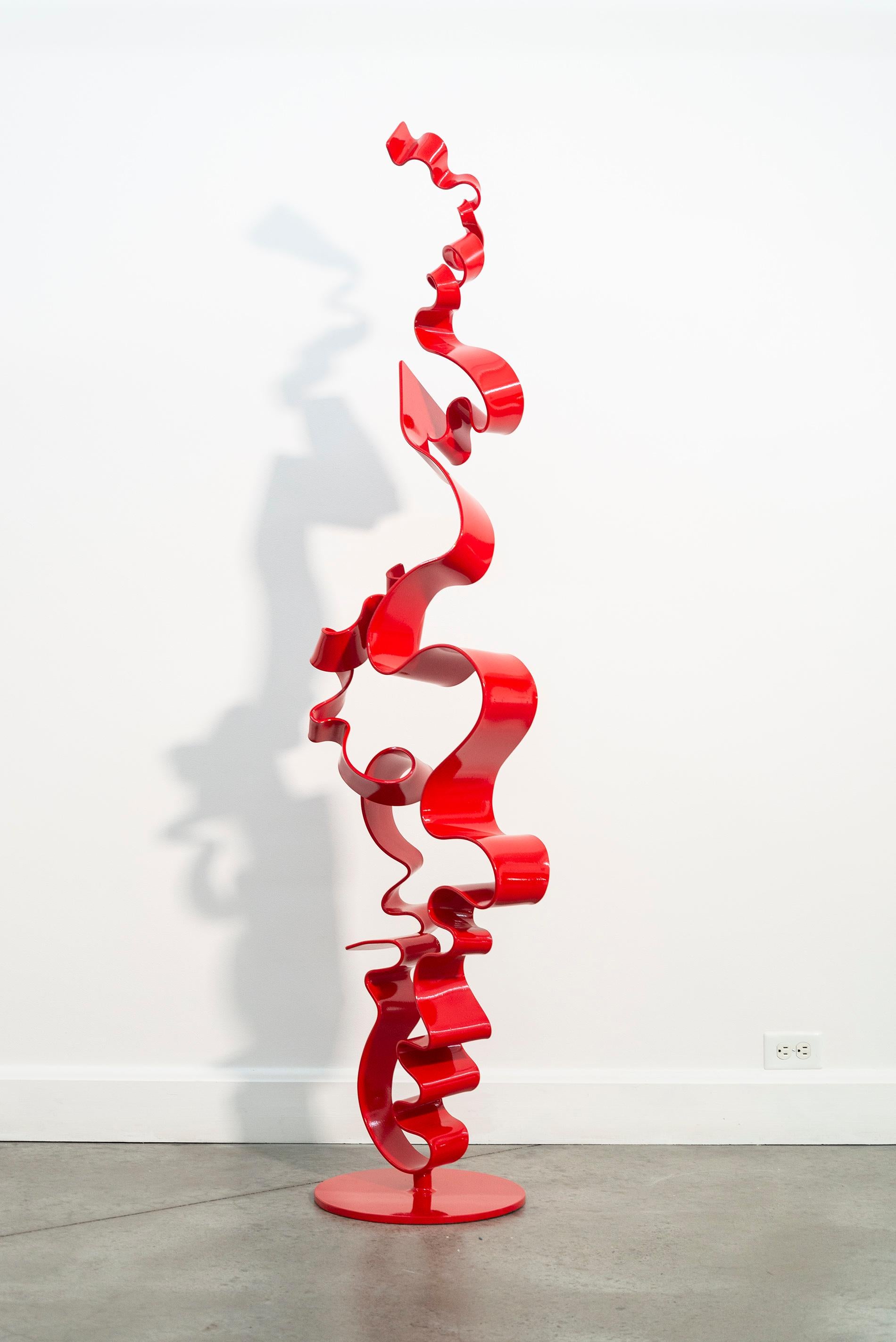 The elegant abstract sculptures of Stefan Duerst are characterized by clean, flowing lines and minimal form hand forged from steel. This piece is a single ‘ribbon’—a contemporary tower of steel that curls and twists skyward. It’s coated in a glossy