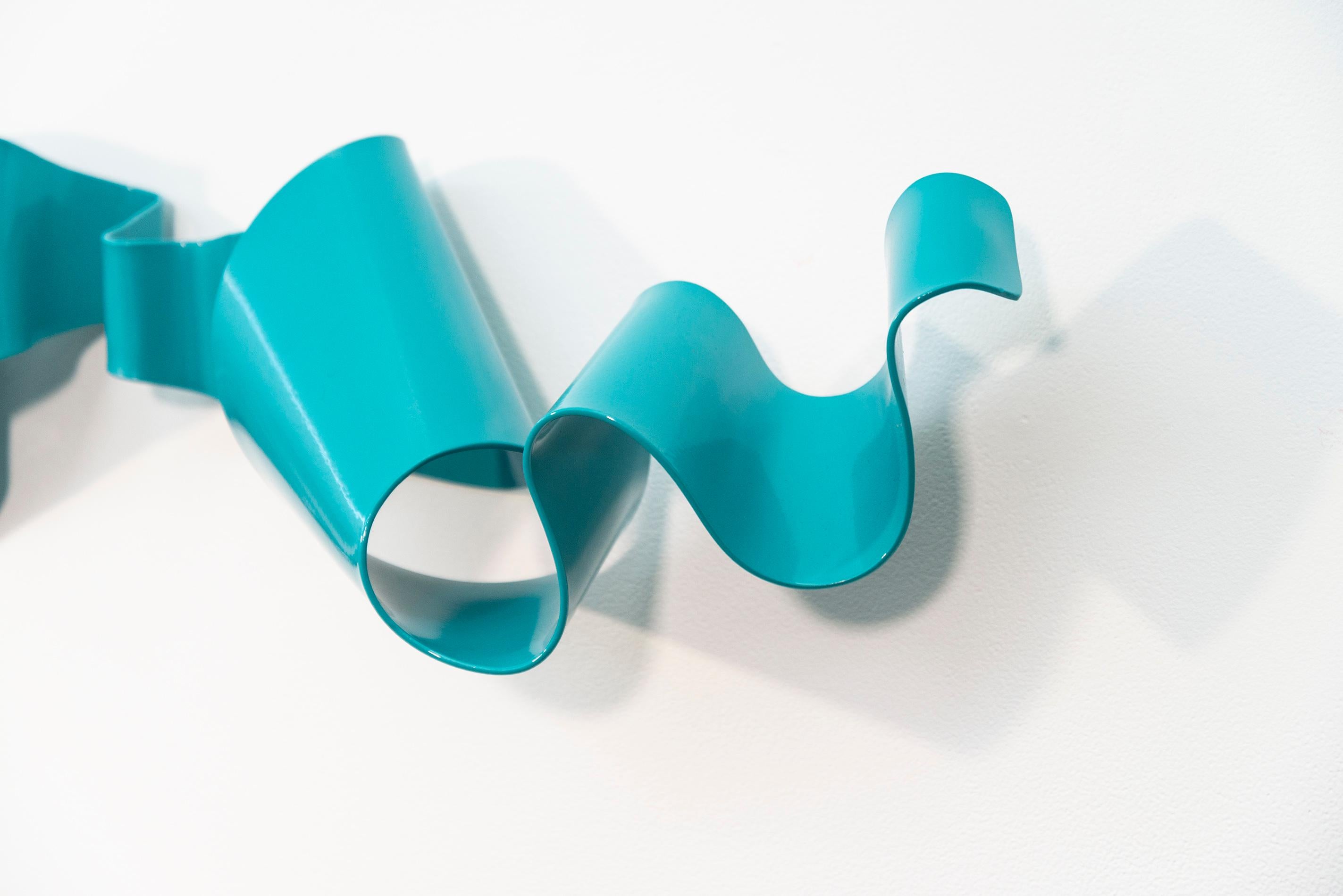 Sculptor Stefan Duerst hand forges steel to create uniquely lyrical abstract sculptures. Their dynamic form is an expression of the artist’s desire to capture a moment in time. This piece—a single horizontal ribbon of steel that appears to be in