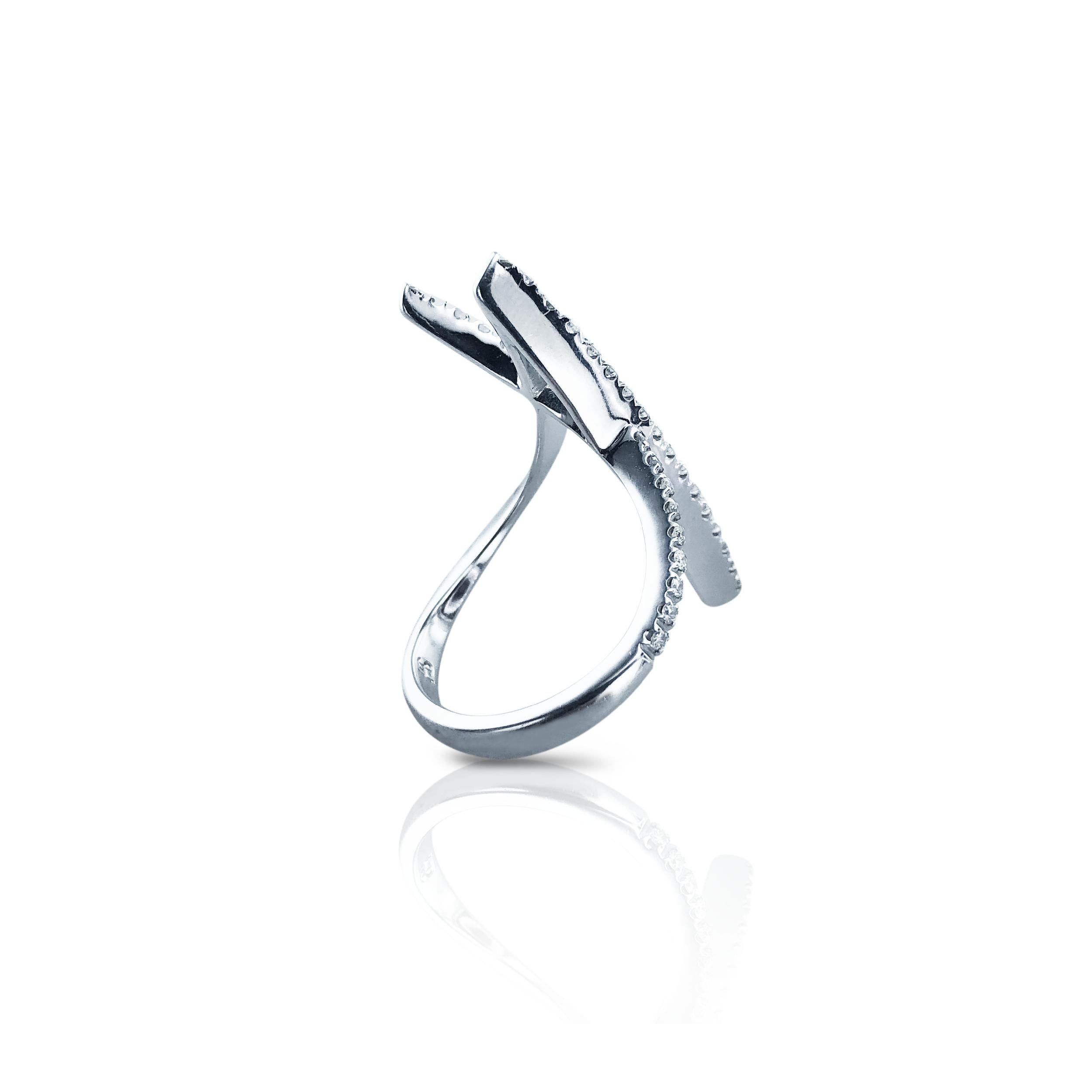 This Diamond Stefan Hafner Art Nouveau Style Ring has a fabulous Italic 'V' Art Nouveau style design, is set in 18kt white Gold with a half pave of 0.35 Carat diamonds.

Wearable as the initial 'V' or an 'A', it is fantastically stylish and