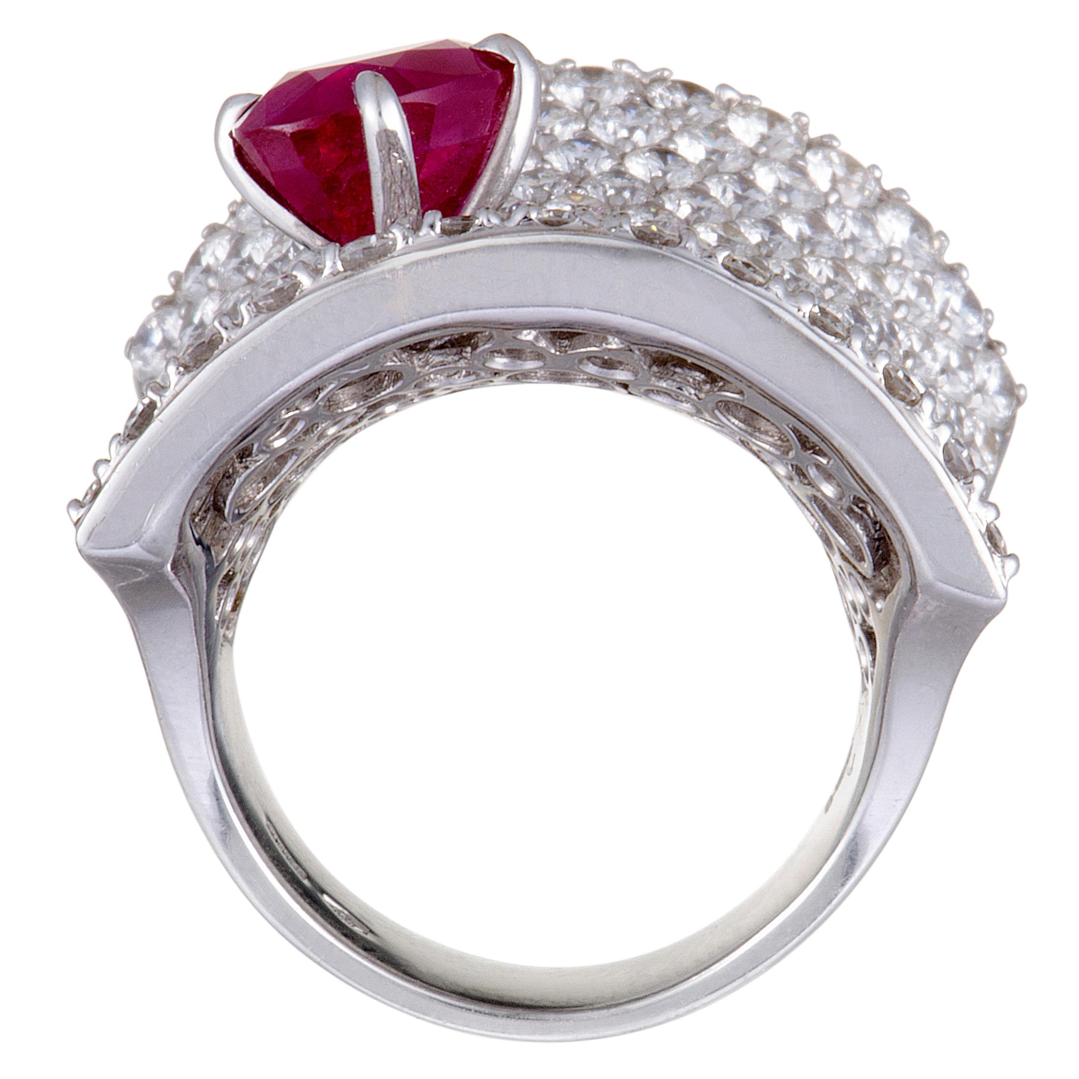 Elevate your style in a captivatingly luxurious fashion with this extraordinary statement piece from Stefan Hafner that is designed in an exceptionally prestigious manner and lavishly decorated with dazzling diamonds and with a striking ruby. The