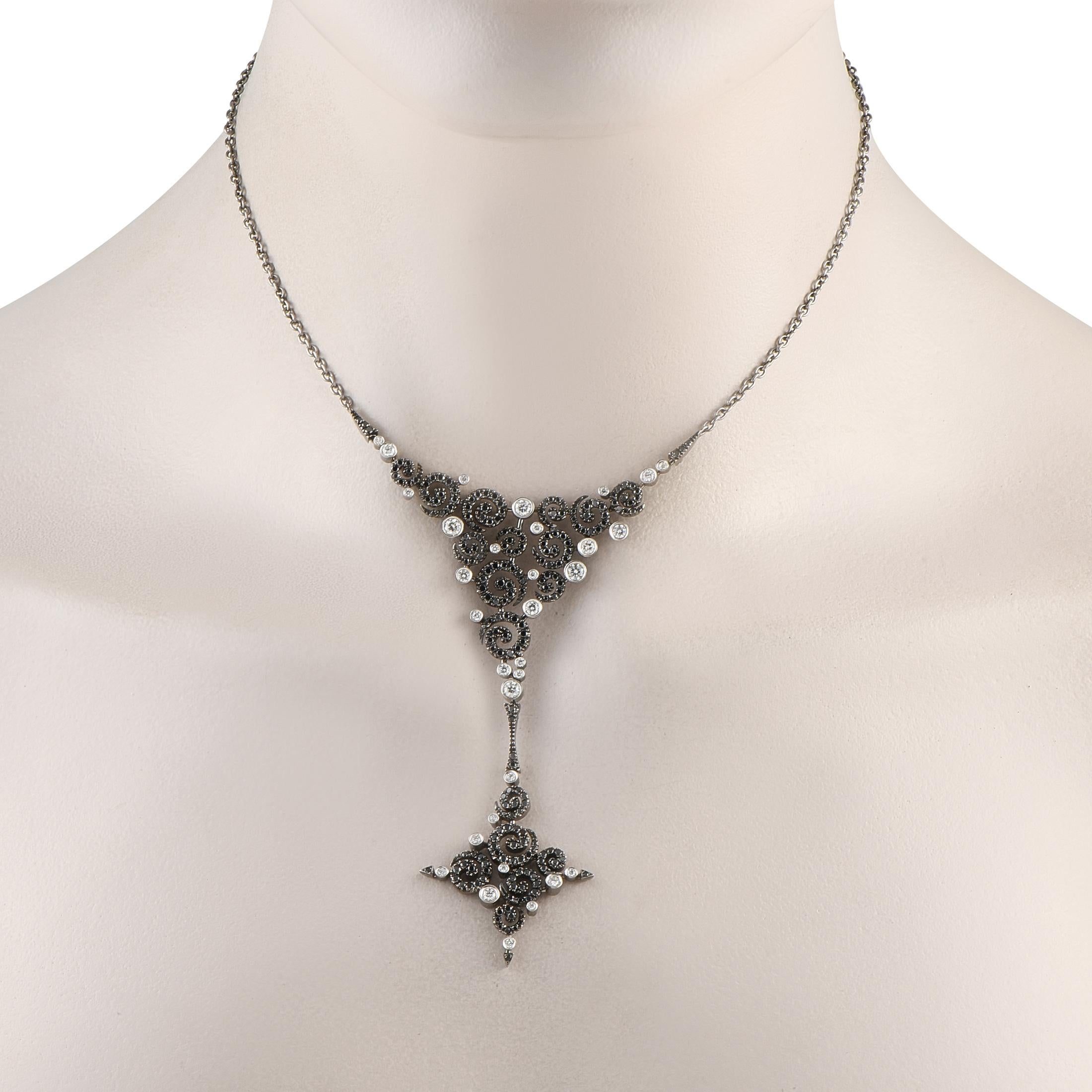 This Stefan Hafner necklace is incredibly dramatic in design. Black Diamonds with a total weight of 2.05 carats instantly draw the eye, while White Diamonds totaling 1.05 carats provide beautiful contrast. This pieces intricate Y-shaped pendant