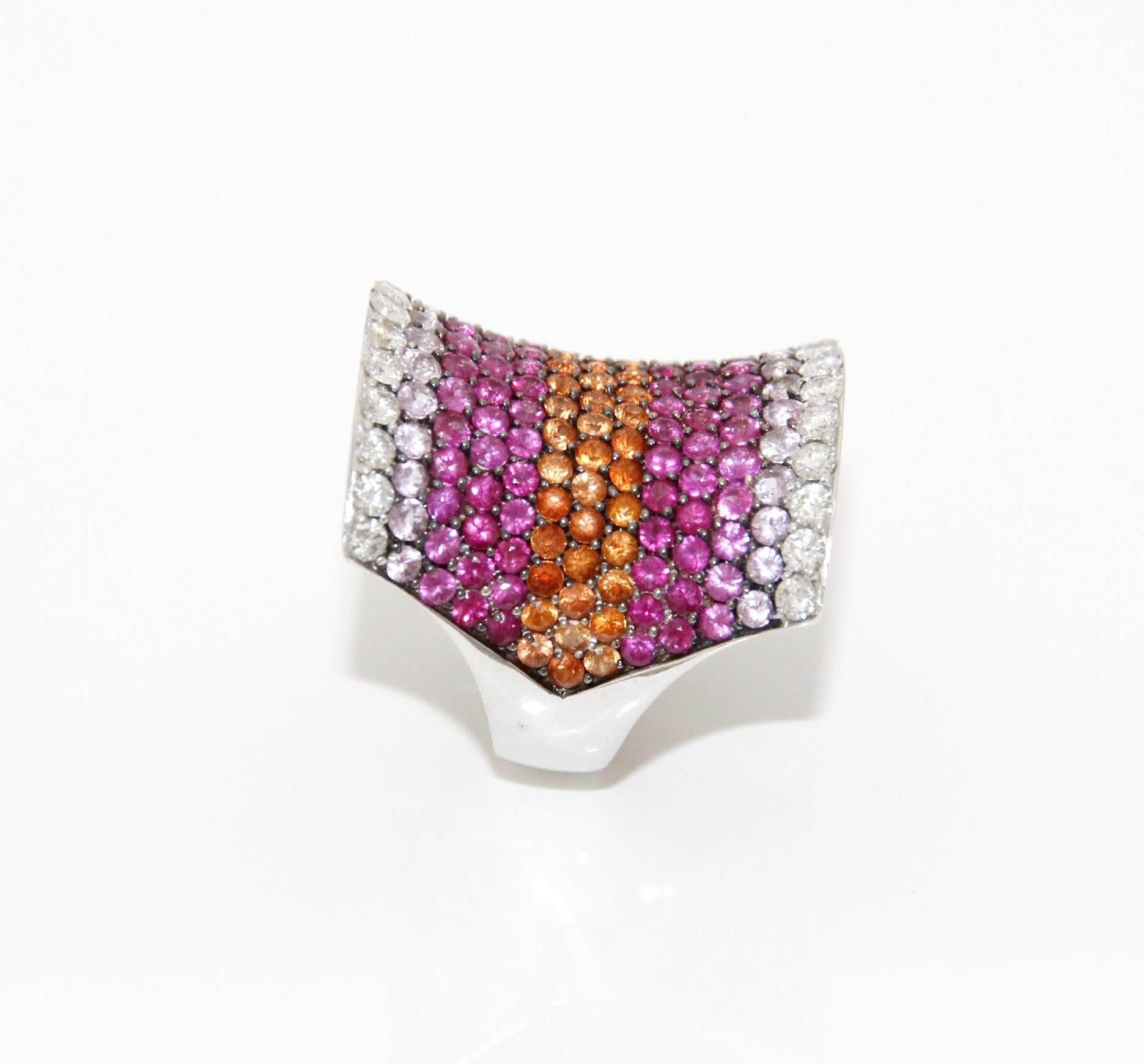 Stefan Hafner 18k White Gold Diamonds and Pink Sapphires Ring
Diamonds 1.31ctw
Sapphires 4.9ctw
Size 7.5ctw
Retail $20,900.00


