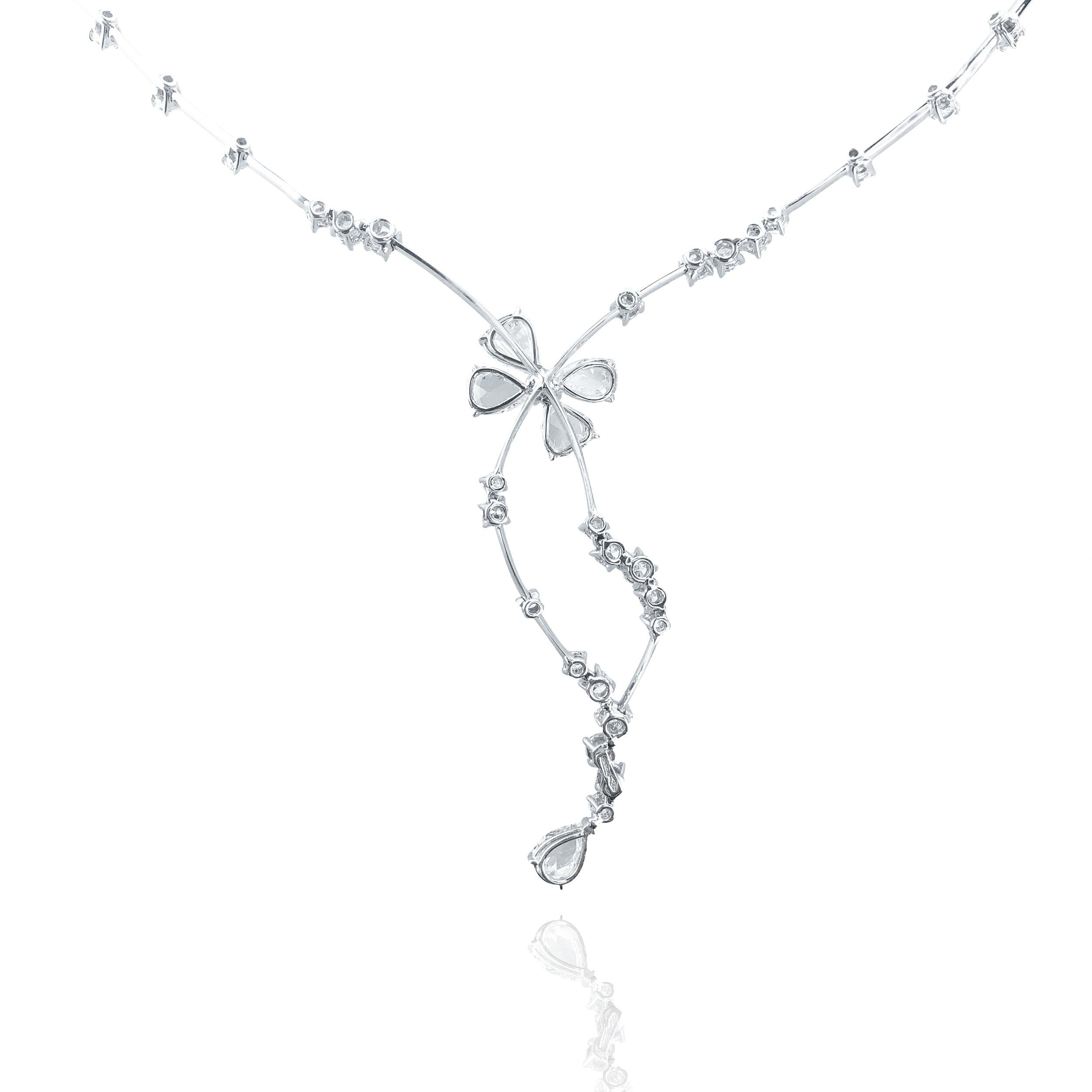 This Rose Cut Bow necklace of 6.18 Carat pure natural diamonds, is set in 18kt white Gold.

The unique chain consists of fine firm white Gold dressed with circular brilliant cut diamonds every 1 cm along the entire chain. 

Leading to the centre