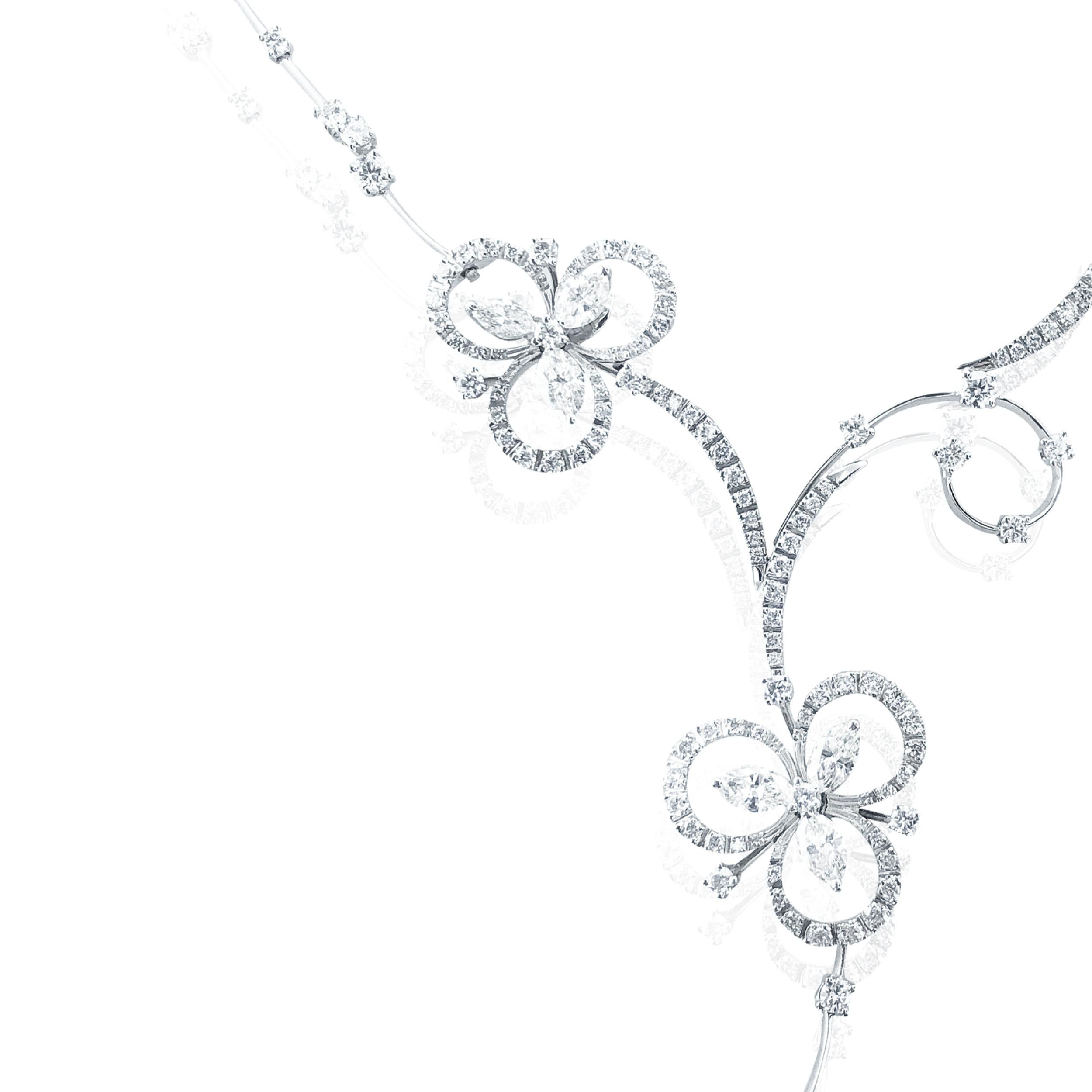 This Stefan Hafner 6.40 Carat 18kt White Gold Lucky Charm Diamond Necklace, is an exquisite and rare Diamond necklace boasting 6.40 Carats of Diamonds in an intricate and precious way.

A unique chain, somewhat similar to a long and short bulk