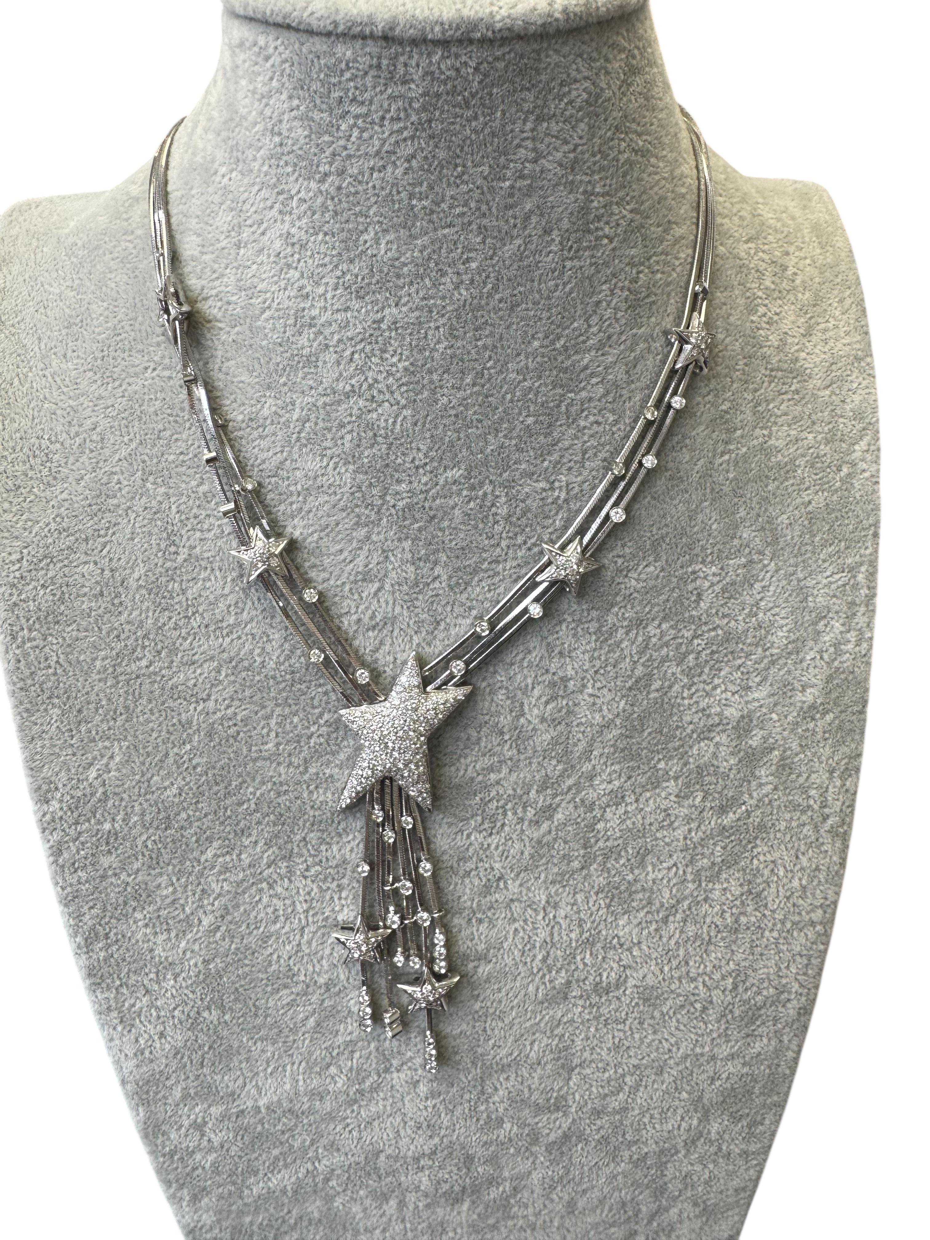 A dazzling statement piece by Italian jewelry house Stefan Hafner, this celestial-inspired necklace is masterfully crafted in 18K white gold. The design features an array of diamond-encrusted stars and delicate shooting star motifs, suspended from a