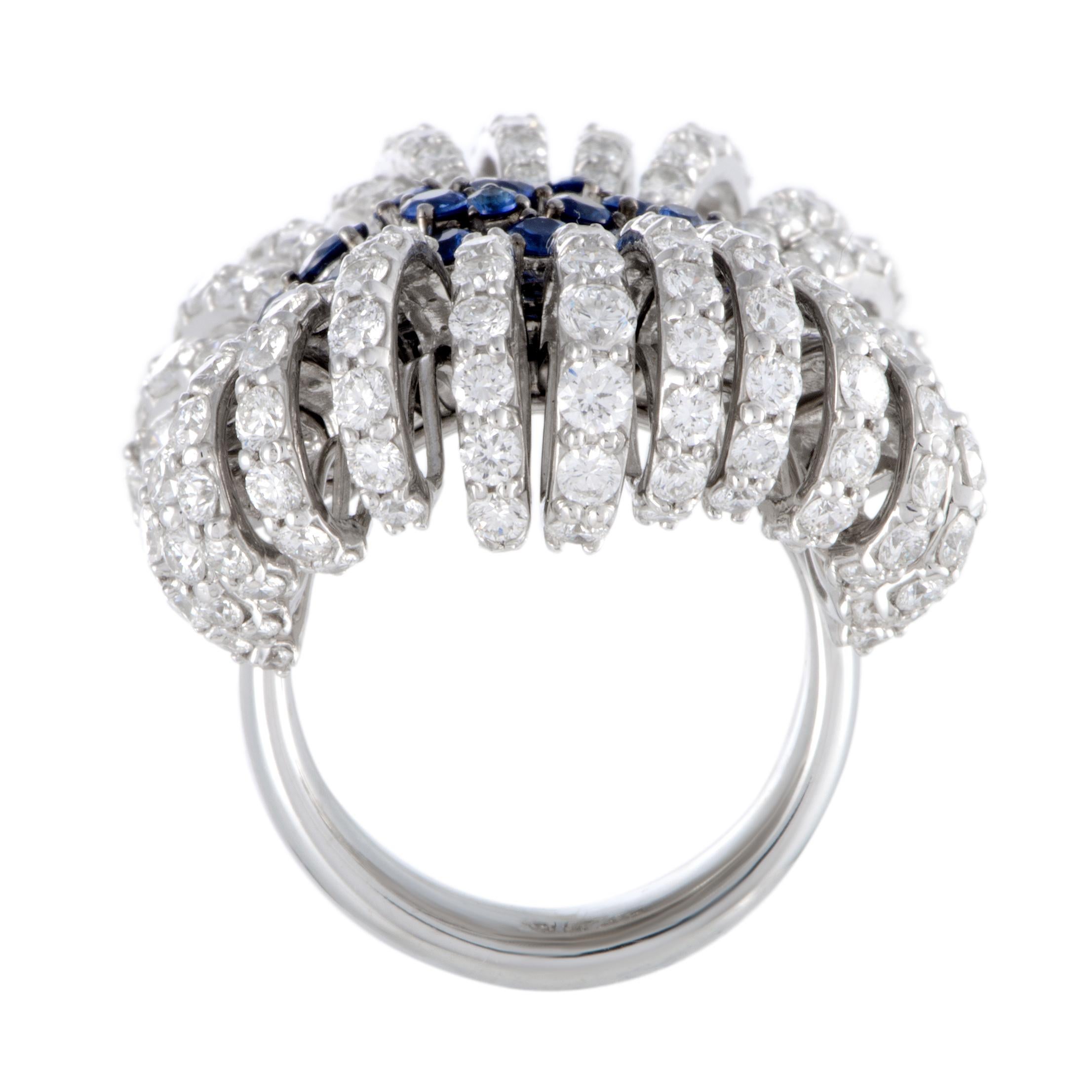 Stefan Hafner merged the attractive appeal of contemporary design with the ever-enticing allure of classic extravagance in this fabulous jewelry piece that compels with its lustrous gemstone décor. The ring is beautifully made of elegant 18K white