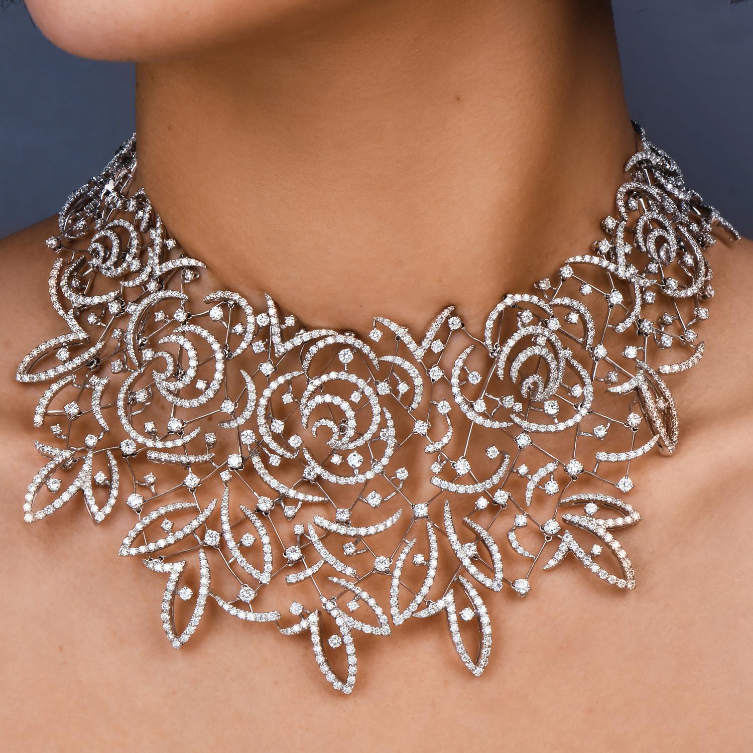 Wear this necklace for that special event. presented by Stefan Hafner, crafted in solid 18K white gold. Meticulously executed exposing an immaculately rendered floral lace pattern covered by genuine extra
white round-faceted diamonds of approx.