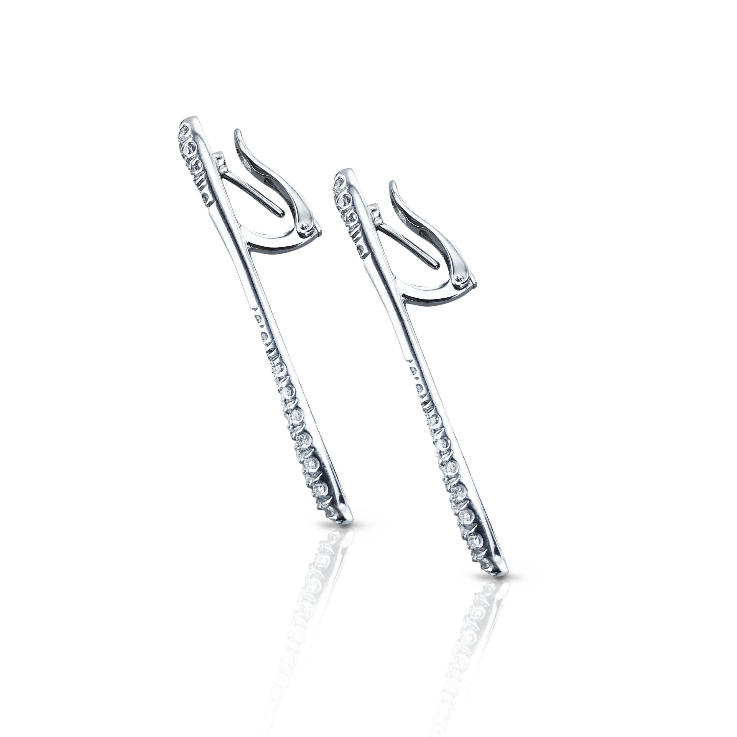 These half pave 0.80 carat vertical dangling diamond earrings, are beautifully set in 18kt white Gold with latch back clasp. 

Using the purest diamonds and excellent Italian craftsmanship. 
The earrings are designed by the famous and very skilled